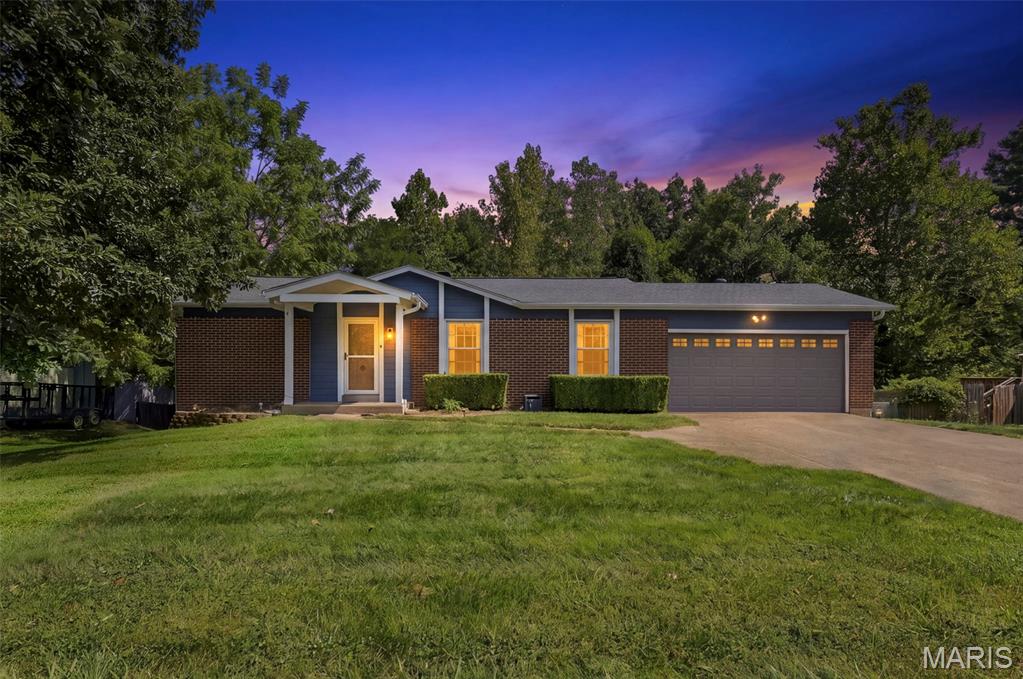 Welcome home to this beautifully maintained 4-bedroom ranch offering 1,636 square feet of comfortable main-level living in the highly sought-after Rockwood School District. Built in 1974 and situated on a generous 0.344-acre lot, this home combines thoughtful updates, inviting living spaces, and scenic outdoor views.

Step inside to an open-concept kitchen and dining area featuring granite countertops, stainless steel appliances, a new dishwasher, and a charming wood-burning fireplace that creates the perfect gathering space. Luxury vinyl plank flooring has been recently installed throughout all bedrooms and the partially finished lower level, adding both style and durability.

The spacious primary suite includes a private bath with a vanity table and direct access to the expansive composite wraparound deck. A second full bathroom on the main level provides added convenience for family and guests.

Designed for both everyday living and entertaining, the walkout lower level opens to a screened-in porch and offers the ideal space for game days, movie nights, or hosting friends and family. Outside, you'll fall in love with the wraparound composite deck overlooking the trees and Fishpot Creek—a peaceful setting that's perfect for morning coffee, evening gatherings, or relaxing with a glass of wine. The fenced backyard provides plenty of room for pets, play, and outdoor enjoyment.

If you've been searching for a home that offers comfortable ranch-style living, updated finishes, exceptional indoor and outdoor entertaining spaces, and a tranquil natural backdrop, this one is not to be missed.