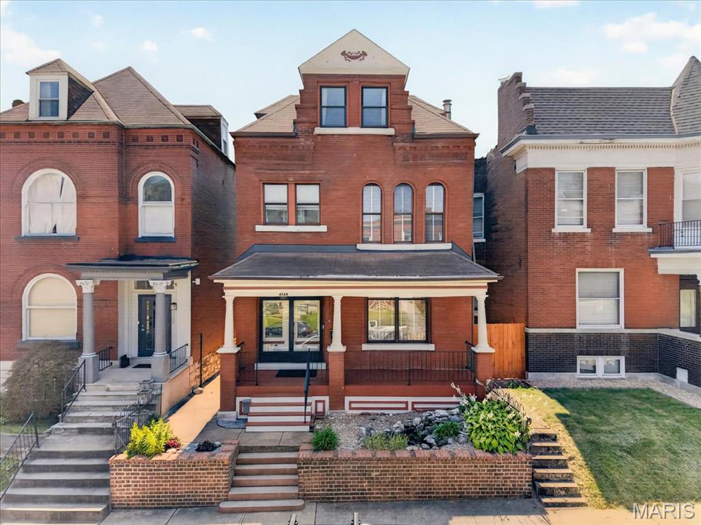 Historic Elegance Meets Modern Living in The Grove.  Beautifully maintained and thoughtfully updated, this elegant 2.5-story home beautifully blends timeless historic character with the comfort and amenities today’s buyers desire. Ideally situated in The Grove, the home is within easy walking distance of Barnes-Jewish Hospital, the Central West End, The Grove District, and Chouteau Park, with Fern Grove Coffee Shop and Amigos Mexican eatery just steps away.  A handsome brick exterior and welcoming front porch set the tone for the timeless character found throughout. Inside, original architectural details include a graceful open-turn staircase, soaring 10-foot main-level ceilings, original 9-foot pocket doors, beautiful original wood flooring, ceramic tile flooring, transom windows, and a walk-in cedar closet. The hall bath features elegant marble flooring. The original staircase has been professionally refinished, restoring the beauty of its wood rail, banister, and newel posts. Fresh interior paint throughout creates a bright, polished feel while complementing the home’s historic details.  The inviting open floor plan provides an ideal setting for both everyday living and entertaining. The chef’s kitchen features granite countertops, glass-tile backsplash, stainless-steel appliances, 42-inch cabinetry, and durable luxury vinyl plank flooring.  Exceptional flexibility comes with two spacious primary suites. The second-floor primary suite features a beautifully remodeled bath, while the expansive third-floor suite offers a private retreat complete with a luxurious bath and classic clawfoot tub. The second floor also includes a generous third bedroom, charming den/library with a wall of bookshelves, and remodeled hall bath.  Outdoor living extends the home’s entertaining space with inviting front and rear porches, a covered deck, brick patio, and private fenced yard—perfect for morning coffee, gatherings, or relaxing outdoors. Professionally resurfaced first-floor hardwood floors add to the home’s move-in-ready appeal.  Additional highlights include an oversized two-car garage, second HVAC system, brand new rear deck with low maintenance vinyl planks & aluminum railing, updated hot water heater, and numerous other thoughtful improvements.  A rare opportunity to own a home where historic charm, modern updates, exceptional outdoor spaces, and one of St. Louis’ most vibrant walkable neighborhoods come together. Welcome home to The Grove.