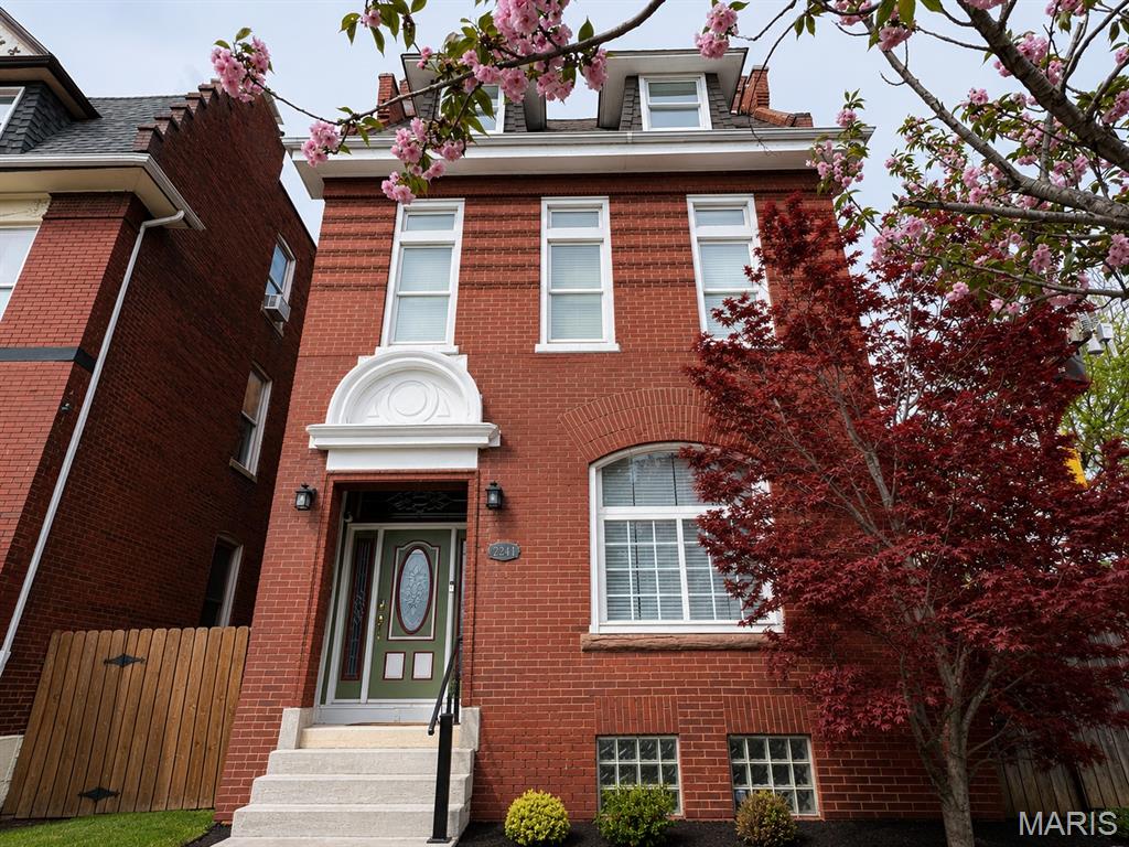 Welcome to 2241 Shenandoah Ave.—a spacious historic stunner in the heart of McKinley Heights. Spanning three stories with 4+ bedrooms, this home delivers all the character you love with the modern updates you want. Fresh paint, new carpet, hardwood floors, and a beautifully renovated second-floor bath make it truly move-in ready.

The bright, airy main level features soaring ceilings, oversized windows, and open living and dining spaces made for gathering. A flexible main-floor bedroom doubles perfectly as a home office, den, or guest room. The dining room flows easily into the kitchen and includes a large storage closet and dedicated wine storage—because every good dinner party deserves both.

Upstairs, you’ll find 3+ bedrooms and a generously sized laundry room. The roomy primary bedroom features an impressive walk-in closet, while another bedroom opens to a private deck and includes an adjoining nursery, office, or chill-out space. The updated bath brings a little luxury to the everyday with a jetted tub and separate walk-in shower.

The third floor feels like its own private hideaway, offering a fourth bedroom with a walk-in closet and ensuite full bath—ideal for guests, teens, a blended household, or anyone who appreciates having a floor to themselves.

Outside, enjoy a low-maintenance fenced yard, two-car garage port, and side yard with plenty of room for pets, gardening, grilling, and summer get-togethers. And the location? Hard to beat. You’re close to Taylor Park, Tower Grove Park’s farmers market and food trucks, and neighborhood favorites like Little Fox, Lona’s Lil Eats, Hodak’s, and Diana’s Bakery. Walk or bike to Lafayette Square, Soulard, and Downtown St. Louis. Historic charm, serious space, and a neighborhood that puts the best of the city within easy reach—2241 Shenandoah is ready for its next chapter.
