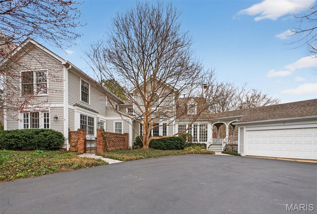 Showings begin March 20th - Discover the perfect blend of old-world charm and modern updates in this beautiful Ladue home. From the moment you arrive, timeless architectural details and inviting curb appeal create a warm and welcoming first impression. Inside, gorgeous wood floors flow throughout the living spaces, showcasing the home’s craftsmanship and character. A stunning staircase serves as a striking focal point, adding elegance and classic charm the moment you step inside.
The light-filled living areas offer a comfortable flow ideal for both everyday living and entertaining. The updated kitchen features modern appliances, generous counter space, and stylish finishes that complement the home’s original character. Luxurious new bathrooms by Chouteau Construction provide spa-like comfort with high-end finishes and thoughtful design, while spacious bedrooms create relaxing retreats.
Step out to a gorgeous temperature controlled sunroom that runs along the entire back of the home, offering the perfect space to relax, entertain, or enjoy peaceful views year-round. Outside, the yard has beautiful gardens and a fountain as well as lovely yard. Ideally located near shopping, dining, and parks, this home offers the best of both worlds—historic charm paired with modern updates today’s buyers love.