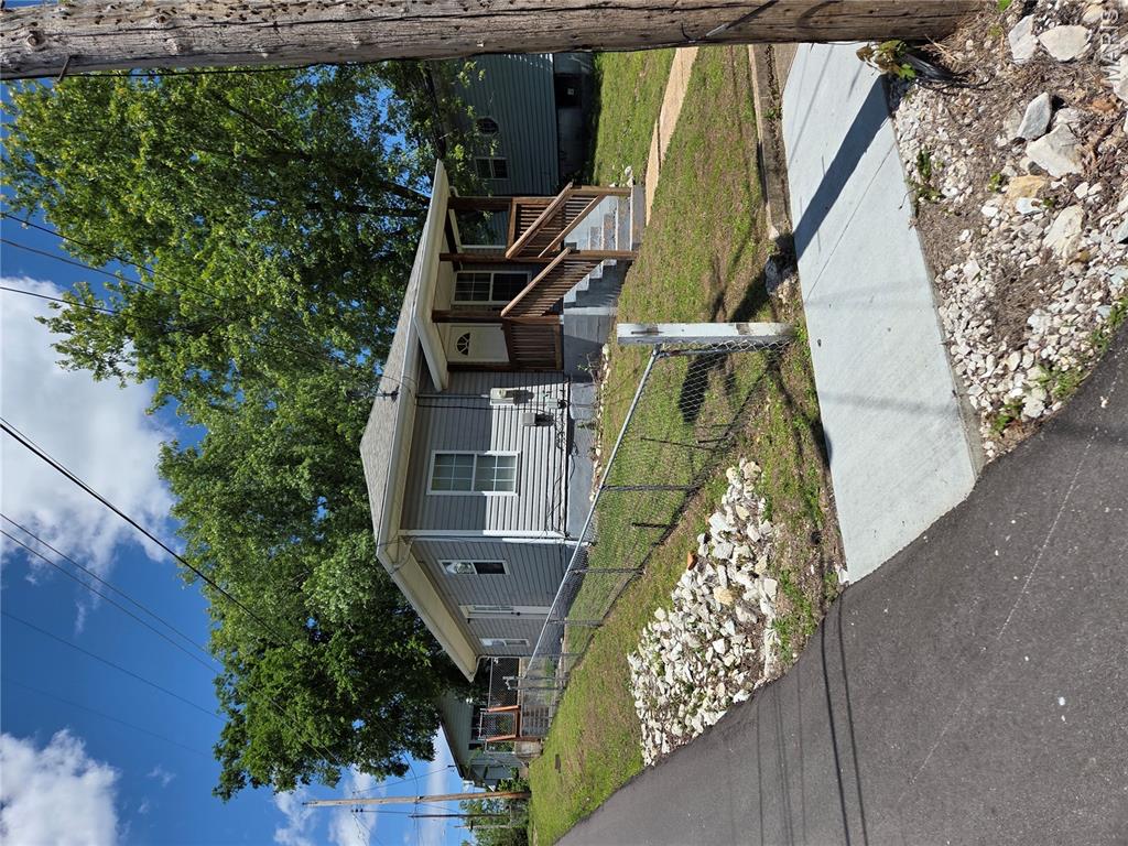 Great little house in town. Some updates, Sewer line to street replaced last year.  Newer windows. Stove and Refrigerator stay.  2 car parking pad in back of house in the alley.