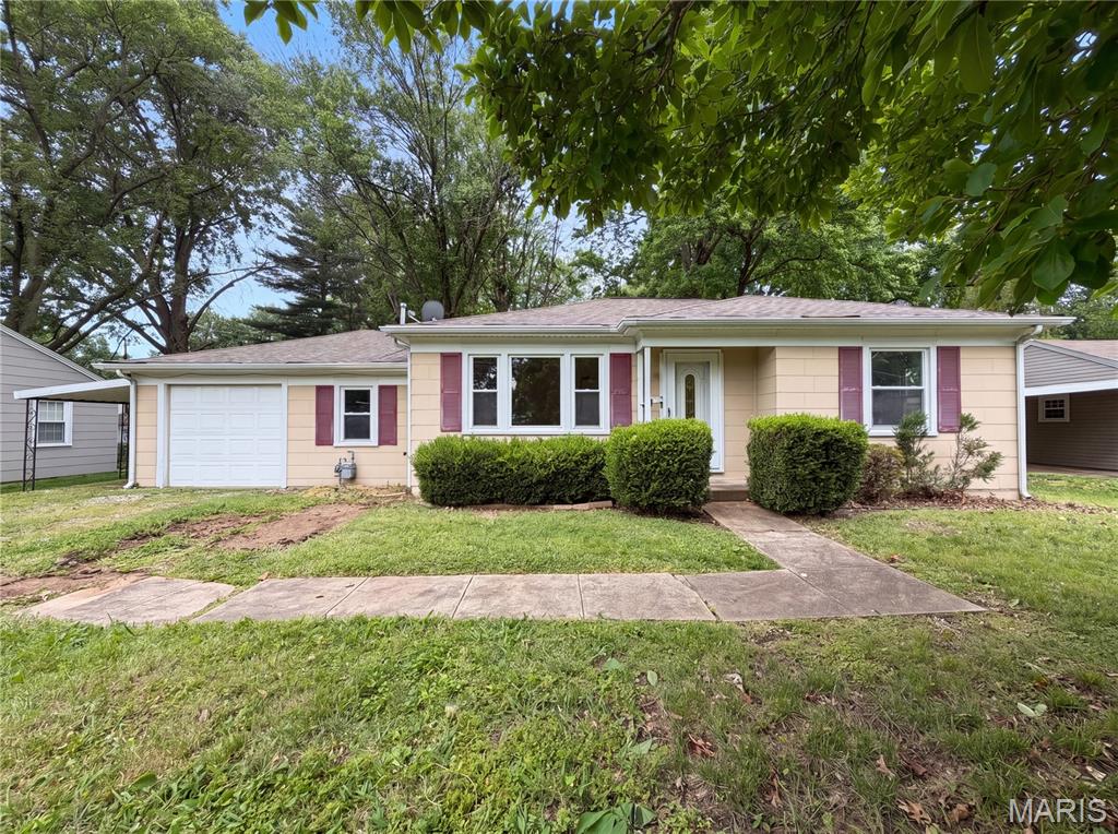 Don't miss 1607 N 17th St, a residence built for everyday practicality and comfortable living. A welcoming fireplace provides interior comfort, while a spacious patio extends an outdoor area for relaxation. The exterior also features a fully fenced in backyard, enhancing usability and containment. This property blends interior comfort with secure outdoor enjoyment. Included 100-Day Home Warranty with buyer activation
