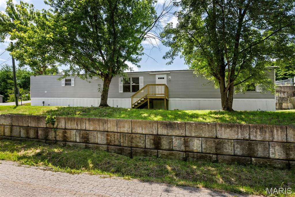 Welcome home to this 3 bedroom, 2 full bath mobile home with 1216 sq ft of beautiful living space. Open floor plan with a spacious living room boasting tons of natural light from the surrounding windows and updated flooring throughout. Eat-in kitchen features a dining area, tons of counter & cabinet space for storage and stainless steel appliances. Living room features an electric fireplace to stay with home. The master bedroom is large with a double closet and private master bathroom that offers an oversized vanity and tub/shower combo. There are 2 additional nicely sized bedrooms with large closets and another full bathroom. A convenient laundry nook can be found in the hallway by the backdoor that leads out to a small back porch and stairs to a semi-private yard that is perfect for relaxing on a gorgeous day or entertaining guests. Enjoy your favorite local restaurants and shopping centers nearby. Do not hesitate in making your appointment to come and check out this home today!
