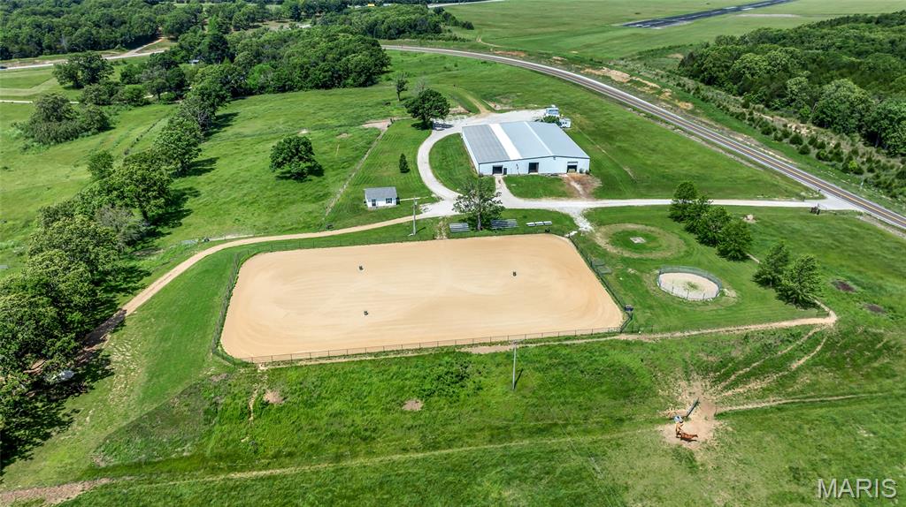 Exceptional equestrian opportunity on ~23 beautiful acres in a prime location just 15 minutes from St. James, less than 20 minutes from Rolla, and with convenient access to I-44. This versatile horse facility is perfectly set up for boarding, training, clinics, fun shows, and equestrian events.

The centerpiece of the property is the impressive 120x70 indoor arena with excellent airflow, attached to an 18 stall barn featuring automatic waterers in every stall, exhaust fans, all new LED lighting, indoor hay storage, tack room, wash bay with hot and cold water, heated and cooled office space, and a bathroom conveniently located within the barn area.

Outside, the massive 150x250 outdoor arena with high end pipe fencing and bench seating creates an incredible setup for hosting clinics, fun shows, events, and group riding activities with ample room for trailers, spectators, and participants. The property also includes a 50' round pen, two 50 amp RV/trailer hookups, and extensive parking areas to easily accommodate larger gatherings and horse events.

The acreage is fenced and cross fenced into 5 separate pastures, all with access to automatic waterers installed last year. A recently remodeled small home on the property offers excellent potential as a caretaker’s residence, rental property, or housing for a college student. 

There is also plenty of room to build your dream or forever home while taking full advantage of the existing equestrian infrastructure already in place.

A rare opportunity to own a well equipped equestrian property with the infrastructure already in place for both everyday horse operations and larger scale equine events.