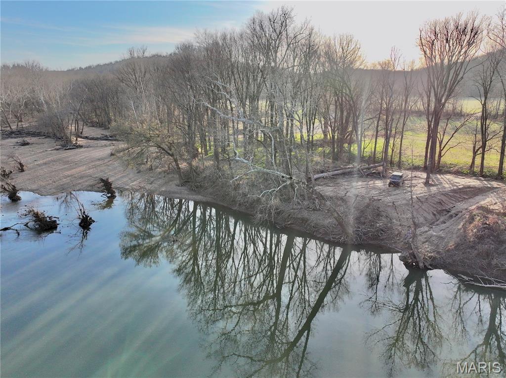14.44 surveyed acres offering a prime blend of seclusion, accessibility, and Gasconade River enjoyment—just 3.5 miles north of I-44. This tract features 192 feet of direct river frontage along a beautiful stretch of the Gasconade, paired with a secondary deeded access point onto a nice gravel bar, giving you multiple options to enjoy the water. A rocked driveway is already in place leading to a prepped build site with power on site, making this property ready for your cabin, home, or weekend getaway.
The land offers a great mix of open ground and mature timber, with a tall canopy lining the riverbank that provides excellent shade and a scenic, park-like setting. The topography allows for strong views in multiple directions, whether you’re overlooking the timber, open ground, or down toward the river corridor. An electric gate at the entrance adds both convenience and security, while maintaining the privacy you want in a recreational property.
Whether you’re looking to build, hunt, or simply enjoy time on the river, this tract checks all the boxes. Additional adjoining acreage is available upon request, offering room to expand or customize to your needs.