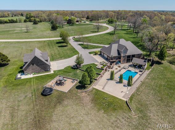 STUNNING ONE OF A KIND PROPERTY on 7.84 ACRES INSIDE THE CITY ! This home HAS IT ALL ! BRICK-STONE EXTERIOR, ALL NEWER INTERIOR UPGRADES. THIS LUXURY HOME offers 4-5 BEDROOMS, 4.5 BATHS, VERY OPEN FLOOR PLAN, VOLUME CEILINGS. PLUSH MASTER SUITE. LARGE CUSTOM TILE SHOWER, HEATED SOAKING TUB, and WALK IN CLOSET. 2 STORY ENTRY & LIVING ROOM W/FIREPLACE, BEAUTIFUL KITCHEN,W/ STAINLESS APPLIANCES, DBL OVEN WALK IN PANTRY, GRANITE COUNTER TOPS TROUGH OUT, FORMAL DINING, HOME OFFICE, LARGE LAUNDRY AREA, 2 BEDROOMS ON THE UPPER LEVEL BOTH ON SUITES W-WIC. +STORAGE ROOM, LOWER LEVEL FAMILY RECREATION ROOM WETBAR, 2 ADDITIONAL BEDROOMS, EXERCISE ROOM, UPPER & LOWER SCREENED PORCHES. HOME w/6458 Sq ft NOW LETS TALK ABOUT THAT OUTDOOR SPACE WOW! BEAUTIFUL IN-GROUND POOL, OUTDOOR FIREPLACE. BASKETBALL COURT,NEWER DETACHED GARAGE THAT WILL HOLD UP TO 8 CARS, A SAFE ROOM, UPPER LEVEL FAMILY RECREATION ROOM, FULL BATH, AWESOME BAR -MAN CAVE. EXTENDED LIVING AREA FOR GUEST OR FAMILY.