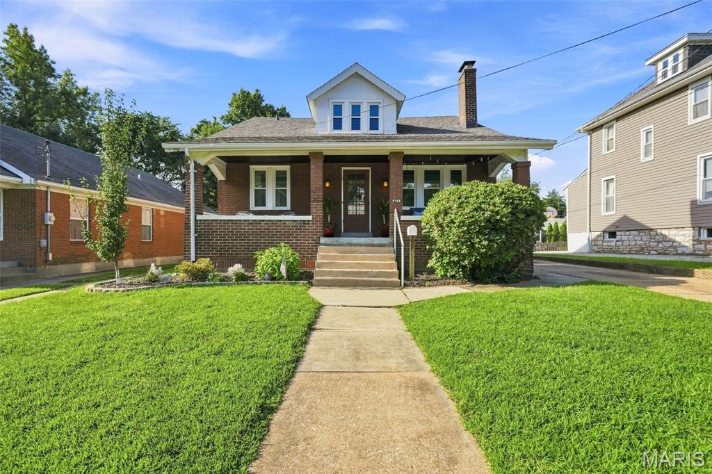 Charming 1.5-story Craftsman in Shrewsbury, located in the Webster Groves School District! The inviting covered front porch with beadboard ceiling and classic porch swing welcomes you into this 4-bedroom, 2-bath home with plenty of character and more space than you might expect. Hardwood floors and stained glass highlight the living room with gas fireplace, while the adjoining dining room leads to the updated kitchen with farmhouse sink and granite tile counters. Just beyond is a spacious rear addition with room for a family room, breakfast area and home office. Two bedrooms and a full bath complete the main level. Upstairs are two additional bedrooms, a second full bath and a bonus nook, all with hardwood floors. Newer windows ('23/'24) and a new roof ('25) are great updates to this classic home. The unfinished lower level offers great storage, access to the tuck-under 2-car garage and potential for additional finished space. Outside, enjoy a tree-shaded backyard and a great non-through street. Walk to the shops and restaurants of Old Orchard, the Shrewsbury community pool and nearby parks, with the Shrewsbury Rec Center just minutes away. Convenient highway access is another bonus!