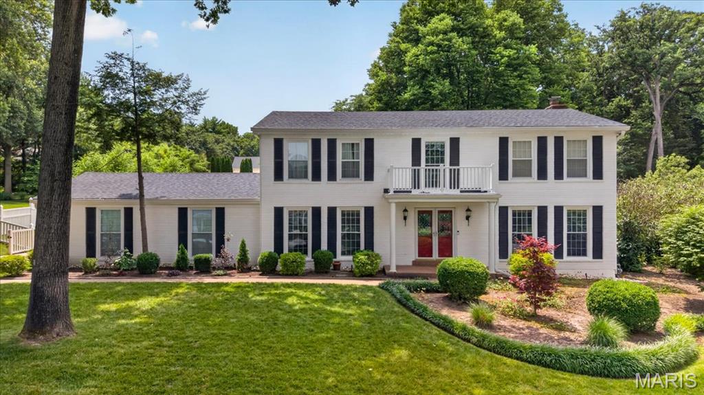 Perfectly positioned in the heart of highly sought-after Mason Valley, this exceptional two-story blends timeless craftsmanship, thoughtfully updated living spaces, and an outdoor setting that’s truly in a class of its own. From the spectacular all-season sunroom to the incredible backyard featuring a private in-ground pool and expansive green space, every space has been thoughtfully designed with comfort, elegance, and everyday living in mind. Rich Brazilian cherry hardwood floors, extensive custom millwork, crown molding, elegant wainscoting, and custom built-ins create warmth and character throughout the main level. Designed with both functionality and flow in mind, the spacious floor plan offers formal living and dining rooms, an inviting family room anchored by a gas fireplace and custom built-ins, and a beautifully renovated kitchen that serves as the heart of the home. Featuring custom soft-close cabinetry, granite countertops, a large center island with Viking gas cooktop, double wall ovens, stainless steel appliances, a beverage refrigerator, walk-in pantry, and abundant prep space, the kitchen blends timeless style with everyday practicality. A convenient serving buffet connects seamlessly to the dining room, while the adjoining breakfast area flows effortlessly into the stunning glass sunroom. Just beyond the kitchen, the spectacular all-season sunroom is one of the home’s signature features. Heated tile floors, soaring vaulted ceilings, and walls of windows create a light-filled space that offers beautiful views of the backyard in every season, making it the perfect place to slow down and simply enjoy your surroundings. Upstairs, the spacious primary suite offers hardwood flooring, dual closets, and a beautifully updated private bath designed to provide a peaceful retreat. Three additional generously sized bedrooms, an updated hall bath, and a spacious loft with custom built-ins and a cozy window seat offer exceptional flexibility for today’s lifestyle. Each bedroom also features its own mini-split system, allowing personalized comfort year-round. The finished lower level continues to impress with a large recreation room, private office, full bath, and abundant storage. Heading back upstairs the thoughtfully designed main floor mudroom with custom lockers, laundry area, and direct access to the backyard and pool adds everyday convenience that’s as practical as it is beautiful. Outside, your private backyard oasis awaits. Beautifully landscaped with a sparkling saltwater in-ground pool, expansive lush green space, mature trees, a spacious patio, pergola, and an incredible custom treehouse, it offers a setting that’s both breathtaking and inviting. Thoughtfully designed for making memories, this exceptional outdoor space is the perfect backdrop for family gatherings, endless summer days, and the moments that make a house truly feel like home. Located just a short walk from Queeny Park, you’ll enjoy easy access to miles of walking trails, playgrounds, and year-round recreation. Premier shopping, dining, and convenient access to Highways 40 and 270 are just minutes away, while children attend highly acclaimed Mason Ridge Elementary and Parkway West schools. Offering an exceptional combination of location, timeless design, and unforgettable indoor-outdoor living, this is a rare opportunity to own one of Mason Valley’s most special homes.