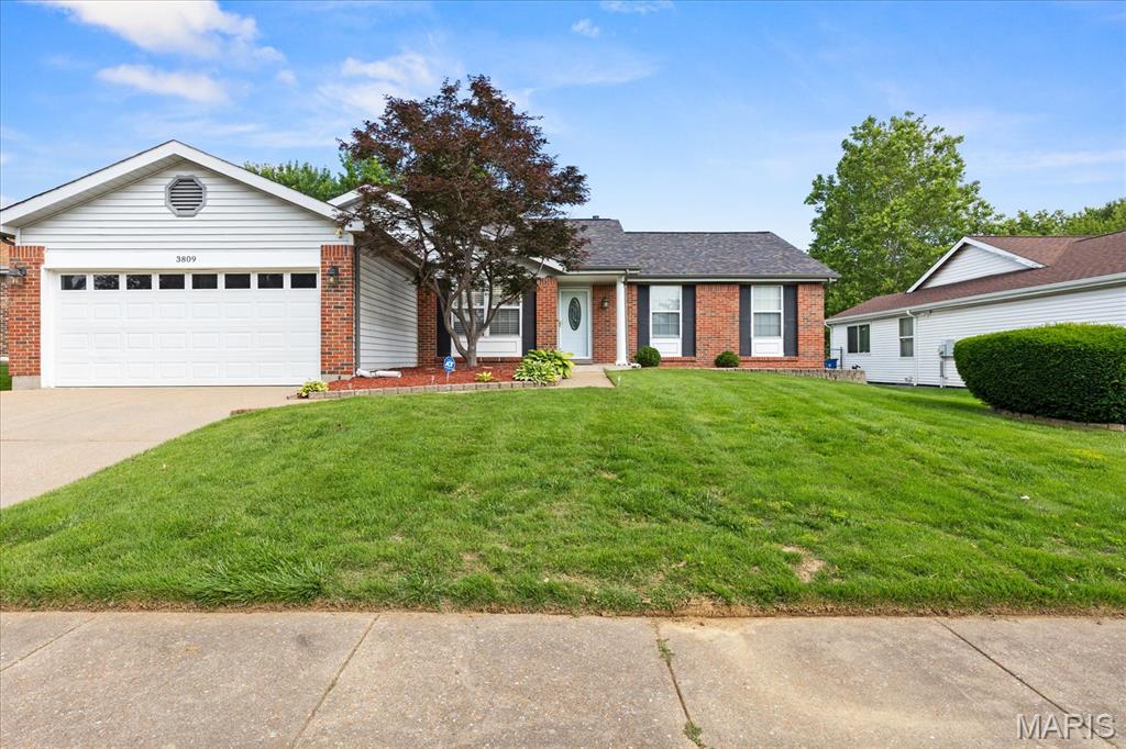 Lovely brick and vinyl sided ranch on large level lot you won't want to miss.  Enter to open living room with wood floors.  Huge vaulted family room with brick fireplace so cozy but light and bright and open to kitchen with stainless appliances (refrigerator does not stay) for great entertaining and staying in the heart of family.  Large primary bedroom suite has oversized custom tiled shower and granite double sink counter top.  Very nice guest bath.  Entertain upstairs and down.  Elegant or casual dining upstairs or make it casual in the lower level rec room equipped with bar, and enough room for a dance party.  Check out the theater room for movie nights.  Stay fit with room for your own exercise equipment.  Main floor laundry.  Two car garage with alcove for extra storage. Covered backyard patio for barbecue even in the rain.  Large level back yard for gardening, playing your favorite yard games or put in a pool.