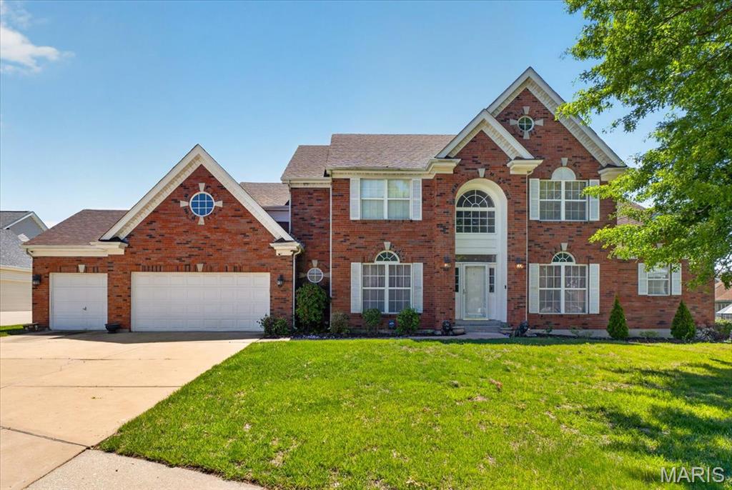 Located in an impressive Florissant neighborhood and within walking distance of Hazelwood North Middle School, this exceptional home offers nearly 4,000 square feet of living space designed for both everyday comfort and unforgettable entertaining! From the moment you arrive, you'll appreciate the oversized driveway, spacious 3-car garage, and outstanding curb appeal. Step inside to discover beautiful original hardwood floors, an updated kitchen, and an absolutely stunning two-story great room featuring soaring ceilings and an abundance of natural light. The main floor primary suite offers a private ensuite bath, creating the perfect retreat. With 5 spacious bedrooms and 4 full bathrooms, there is plenty of room for everyone to spread out comfortably. The large finished basement provides endless possibilities for additional living space, recreation, a home office, or media room. Outdoors, enjoy a large rear patio ideal for entertaining guests while overlooking the expansive backyard perfect for gatherings, play, or relaxing evenings at home. A rare opportunity to own a spacious and beautifully appointed home in a highly desirable location!
