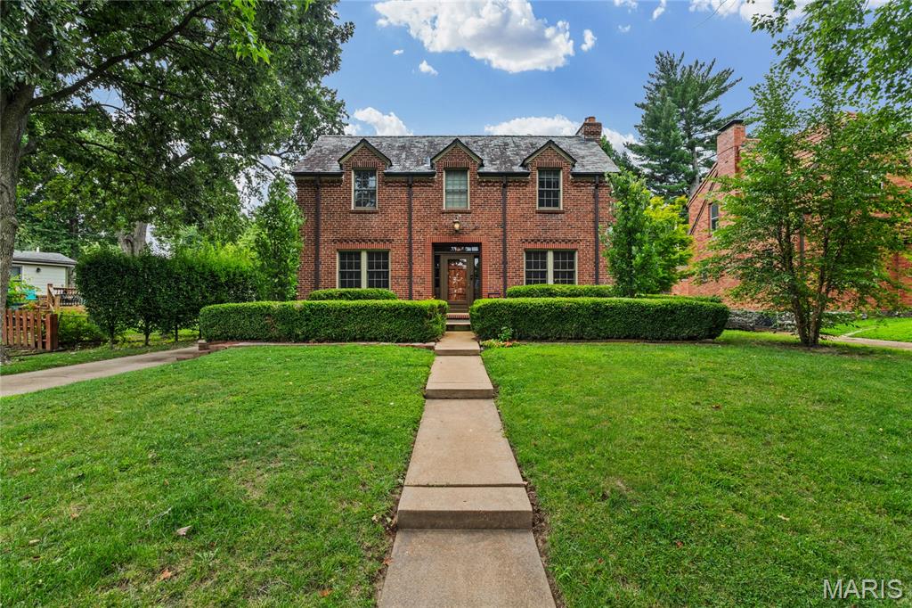 OPEN Sun, 9/6, 1-3pm.  Here's the one you've been waiting for...in historic Pasadena Hills!  The former owner, a renowned St. Louis architect, developer of the Foundry, and Angand Arts Hotel, and previous monthly columnist in the Town and Style, beautifully updated and maintained this stately home. You will see his touches everywhere, but most notably in his collection of unique chandeliers in various rooms of this gorgeous home.  The original gleaming hardwoods welcome you into this home. The center hall plan boasts Living room with a classic stone gas fireplace, dining room with chair rail, original crown molding and unique chandelier, breakfast room, butler's pantry with original built-ins, updated kitchen with white cabinetry, abundant granite counterspace, stainless steel appliances (remain with the home) MAIN FLOOR BEDROOM and full bath; Upstairs find another full bath and 2 large bedrooms, one with a cozy window seat. Walk-up finished lower level with a Rec Rm (or extra sleeping area) plus another large multi-use space for various hobbies or crafts, laundry and storage,  Zoned heating/cooling.. 2 year-new furnace and one year old furnace in the attic will give you peace of mind.  Washer/dryer will remain with the home.  Bonus: two new air scrubbers keep your atmosphere free of allergens, odors and more. Screened-in porch located off the kitchen, leads to the perfectly-sized fenced backyard with a charming patio plus an oversized 2-car garage.  Don't miss your chance to own THIS home listed on the National Register of Historic Places!  Convenient;y located near major hghways...10 minutes to the Airport, Downtown; 15 Minutes to Forest Park and U City loop.  5 minutes to UMSL and Touhill Center. Come see this unique Community for yourself!