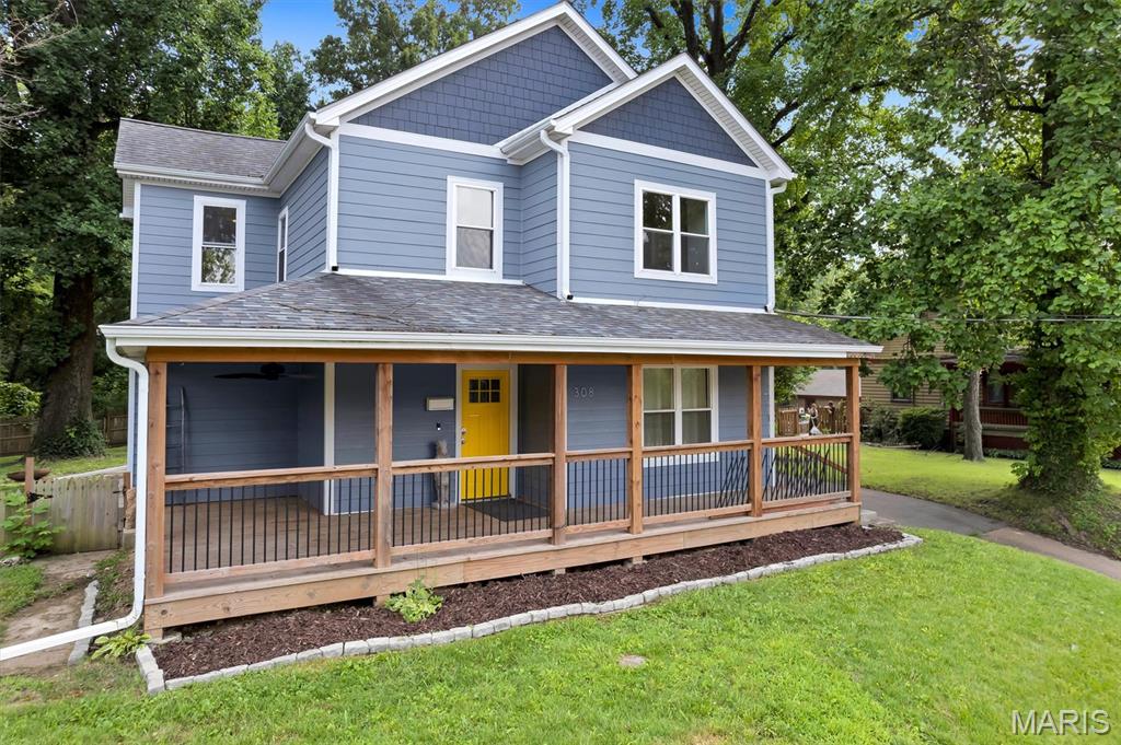 Fall in love with the perfect blend of classic character and today's modern conveniences in this beautiful 4-bedroom, 2.5-bath home. From the moment you arrive, the inviting wraparound front porch, striking blue exterior, and cheerful front door create incredible curb appeal and a warm welcome.
Inside, timeless architectural details—including graceful arched openings, refinished hardwoods, and classic millwork—are complemented by thoughtful updates throughout. The light-filled main level offers an open, flowing layout that's perfect for both everyday living and entertaining. Spacious living and dining areas boast recessed lighting, and stylish finishes that create a bright, contemporary feel while honoring the home's original charm. The beautifully updated kitchen is designed to impress with crisp white cabinetry, quartz countertops, stainless steel appliances, a designer tile backsplash, gas cooktop, wall oven, and convenient breakfast bar overlooking the dining room. Upstairs, you'll find four generously sized bedrooms, offering flexibility for family, guests, or a dedicated home office. The spacious laundry room adds everyday convenience, while the updated baths feature fresh, modern finishes. Throughout the home you'll appreciate the seamless combination of timeless craftsmanship and today's amenities, creating a move-in ready home that feels both elegant and comfortable. There is an electric and gas line from the house to the detached garage for a future back-up generator. Detached 2-car garage as an added bonus! Let's not forget about the expansive outdoor patio, perfect for cookouts. Close to shopping, dining and schools.  Don't miss out on this one, it won't last long!