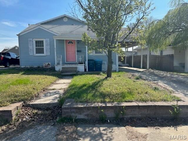 Great Value-Add Opportunity in Wood River! This 4-bedroom, 1-bath, 2-story frame home having 1,590 sq. ft. of living space and plenty of potential for the right buyer. The property features vinyl siding, tile and carpet flooring, and a convenient carport for parking. With its spacious layout and multiple bedrooms, this home provides a solid foundation for renovation or customization. While the property will need some updates, it presents an excellent opportunity for investors, renovators, or buyers looking to add value and make it their own. Located in Wood River close to local amenities, shopping, and schools, this property has strong potential once improvements are completed. Bring your vision and unlock the possibilities!