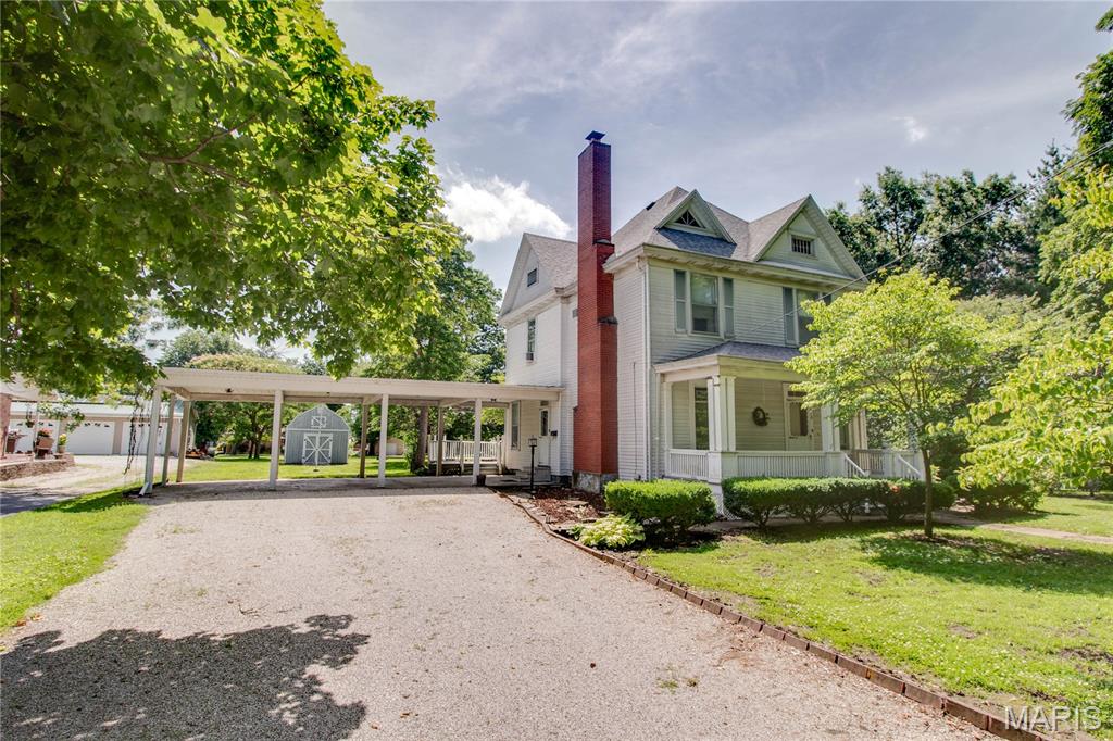 Step into the charm and character of this spacious 4 bedroom, 2 bath home featuring beautiful original details throughout. The formal dining room showcases intricate wood flooring and a built-in China cabinet, while two gas fireplaces add warmth and charm to the living spaces, one in the expansive living room, and the other located in the eat in kitchen. With four spacious bedrooms othe upper level, there's no shortage of space.
Outside, you'll find a covered front porch, large deck, paver patio, huge yard, oversized 3 car carport, storage shed, and a historic brick outbuilding that adds to the property's appeal. If you're looking for space, character, and plenty of room to spread out, this home is one you'll want to see. Call today!