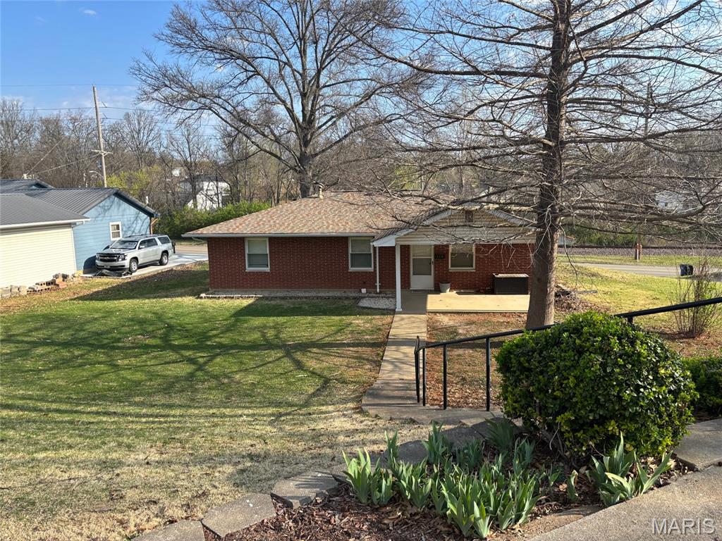Looking for a new family!
This beautiful brick ranch-style home offers three bedrooms and two baths, with  hardwood floors throughout the main living areas. The large living room space flows into an eat-in kitchen, dishwasher, electric range, built in oven, and refrigerator, perfect for everyday meals. The home also features a partially finished lower level with a walk-out garage and a large front yard. With its stylish hip-style roof and design.  Just a short walk to Festus schools.  this home offers timeless comfort in a welcoming setting.