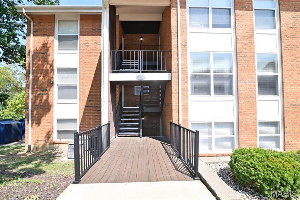 Welcome to 1963 Greenpoint Dr. Unit 203, a spacious 2-bedroom, 2-bath condo offering comfortable, low-maintenance living in Kirkwood’s desirable Greenbriar community! Ideally situated just 7 steps from ground level, this upper-level unit offers the convenience of easy access without the feel of a traditional second-story walk-up. Even better, your private mailbox is conveniently located right outside your front door. Inside, the open and inviting floor plan makes everyday living and entertaining a breeze. The kitchen opens directly to the dining area and features a center island, creating a natural gathering space while keeping the main living areas connected. The spacious living room is highlighted by a cozy gas fireplace and opens to a private covered deck, offering a peaceful spot to enjoy your morning coffee or unwind at the end of the day. The primary bedroom features its own full bath and walk-in closet, while the second bedroom provides excellent flexibility for guests, a home office, or additional living space. In-unit laundry, generous closet space, and a functional layout add to the convenience of this well-appointed home. Enjoy all that Greenbriar has to offer with an in-ground swimming pool, clubhouse, fitness/exercise facilities, tennis courts, basketball court, walking trails, pond, and beautifully maintained common grounds. Additional storage options are also available within the community. With a $425 monthly condo fee, residents can enjoy the benefits of community amenities and a low-maintenance lifestyle. Conveniently located in Kirkwood with easy access to I-270, shopping, dining, parks, and everyday conveniences, this home combines comfort, accessibility, and an abundance of amenities in a fantastic location. Whether you're looking for your first home, downsizing, or simply ready to enjoy a more carefree lifestyle, 1963 Greenpoint Dr. Unit 203 is a wonderful place to call home!