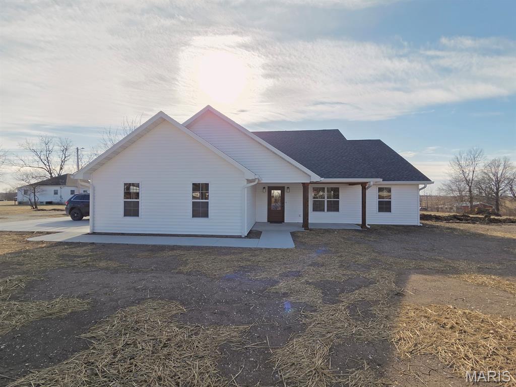 You’ll find small town charm with big style in this beautiful, new-construction home situated on 2 lots near the edge of town. This 3-bed, 2-bath home with an open concept main living and dining space awaits as you step inside the front entry.  You'll appreciate the ample storage throughout, with a separate laundry room conveniently located by the double-car garage and primary suite, and several linen/pantry closets.  The large primary bath and bedroom with walk-in closet will be your well-deserved sanctuary.  Through the kitchen and dining space French Doors lead onto the concrete patio overlooking the back yard.  The open floor plan makes this a perfect home for entertaining or keeping an eye on the kids. 

Other amenities include marble-top vanities in both bathrooms, custom fixtures, luxury vinyl plank flooring throughout the home, dimmer switches and remotes for all lighting and fans - indoor and out. The main living area has recessed lighting in the ceiling, as well as undermount cabinet lighting in the kitchen. All new appliances that will convey include washer, dryer, stove, refrigerator, microwave and dishwasher.  

You'll love the edge-of-town location, and this home is conveniently located near local amenities and on city utilities.  

*Agent Owned*