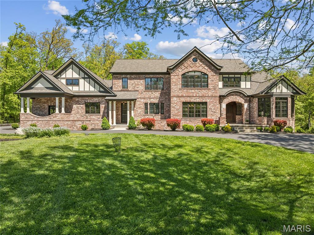 Positioned on one of the most prestigious lots on Countryside Lane in Frontenac, this extraordinary 2017-built estate delivers a rare combination of architectural significance, engineering excellence, and resort-level living. Designed by renowned architect Robert Srote of Srote & Co. Architects and expertly built by R.G. Apel, every element of this home was thoughtfully executed with no expense spared. A true centerpiece of the home is the remarkable 5,500-gallon aquarium—believed to be the largest residential aquarium in Missouri—creating a dramatic, one-of-a-kind focal point that elevates the entire living experience.

Constructed with concrete between the main and second levels, the home offers exceptional sound insulation and structural integrity, complemented by radiant heated floors throughout most living areas for year-round comfort. Every bedroom is a private en-suite, offering comfort and privacy for both family and guests. A 5-car garage adds to the home’s functionality and scale.

The expansive lower-level gymnasium is a blank canvas for luxury recreation—perfectly suited for a golf simulator, private bowling lane, indoor pickleball court, or a custom entertainment venue tailored to your lifestyle.

Set on 1.658 acres backing to deep woods, the outdoor setting is both private and breathtaking. A resort-style natural pool with waterfall, room for a sports court, and serene surroundings create an unmatched retreat experience.

Enhanced by geothermal HVAC, state-of-the-art mechanical systems, and superior construction standards throughout, this home represents a rare opportunity to own a truly distinctive property where design, innovation, and lifestyle converge. Homes of this caliber rarely become available in Frontenac.