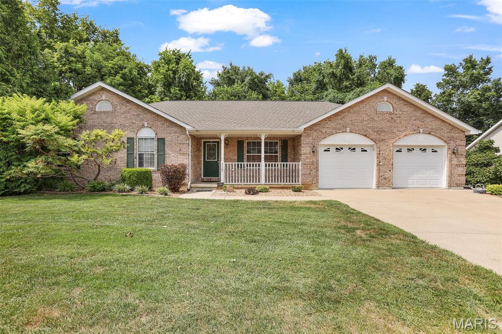 Welcome to this beautiful ranch home nestled on a quiet street in Washington! From the inviting front porch to the spacious, thoughtfully designed interior, this home offers comfortable main-level living with plenty of room to grow. Featuring 3 bedrooms and 2 full baths, the main floor also includes a convenient laundry room and warm hardwood flooring throughout the main living areas. The kitchen offers abundant cabinet space and flows nicely into a separate dining area, perfect for everyday meals or entertaining guests. The walk-out lower level has a finished flex space or craft area, with plenty of unfinished area ready for your vision, offering an excellent opportunity to create additional living space, a recreation area, home office, or whatever best suits your needs. An attached 2-car garage provides convenient parking and storage. New roof and HVAC system installed in 2017! With its quiet setting, inviting curb appeal, functional layout, and exciting lower-level potential, this Washington ranch is ready to welcome you home!
