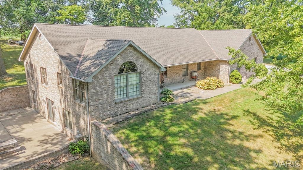 Situated on approximately 4.2 acres near Lake Pittsfield, this spacious brick home offers 5 bedrooms, 3 baths and plenty of room to make your own. The main level features a welcoming living area, kitchen with adjoining dining space, and two bedrooms, including a spacious primary suite with a private bath and walk-in closet. A second full bath is also conveniently located on the main level.

Downstairs, you’ll find three additional bedrooms, a third full bath, family room, laundry area and plenty of extra space for gathering, hobbies or storage. With bedrooms and living space on both levels, the layout gives everyone room to spread out. Geothermal heating and cooling adds another great feature to the home.

Outside, mature trees surround the 4.2-acre setting with plenty of room to enjoy the outdoors. An oversized 3-car attached garage provides ample space for vehicles, equipment and storage. Located just a short distance from Lake Pittsfield, this home offers the space to spread out while still being convenient to town.