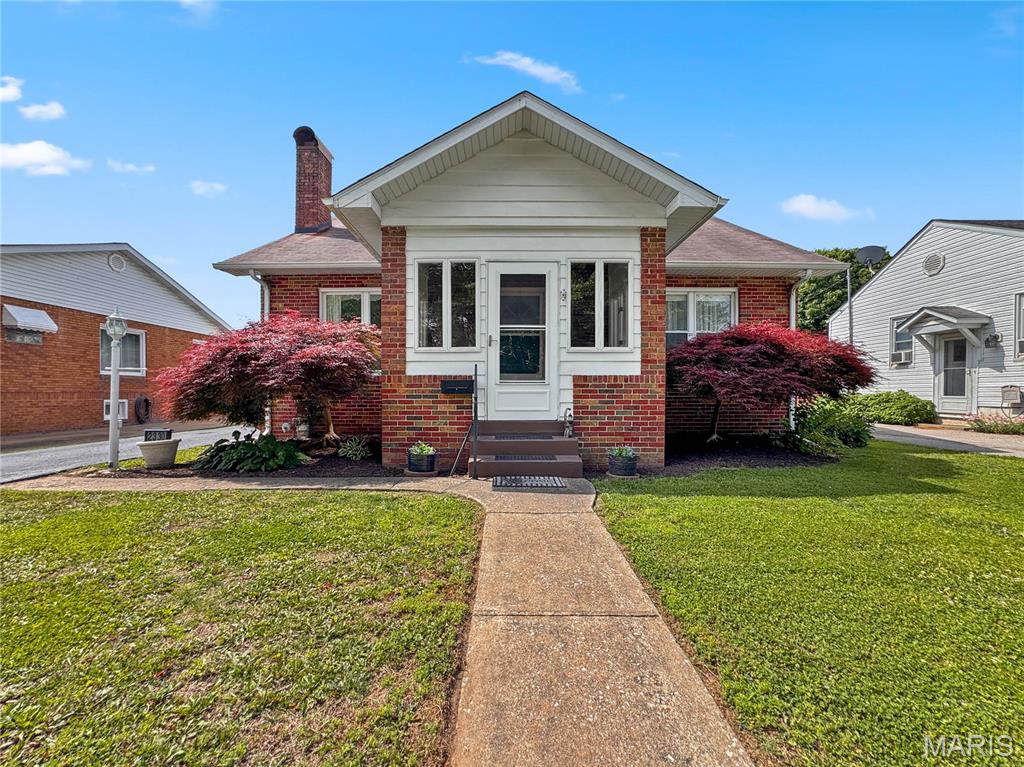 Back on the market, no fault of seller: Welcome home to this delightful 3-bedroom, 2-bath brick bungalow nestled in the sought-after Maryland Place neighborhood. Full of timeless character and cottage-inspired charm, this inviting home offers a warm and welcoming atmosphere from the moment you arrive. Step inside to discover beautiful hardwood floors, stunning original crystal door knobs, and a breathtaking archway that gracefully connects the living room and dining room — showcasing the craftsmanship and charm that makes this home so special. The cozy wood-burning fireplace serves as a beautiful focal point, creating the perfect setting for relaxing evenings at home. Outside, you’ll enjoy the newly installed vinyl privacy fence surrounding the backyard — creating the perfect retreat for relaxing evenings, gardening, pets, or outdoor gatherings. Mature landscaping and classic brick curb appeal further enhance this home’s storybook charm. Whether you’re sipping coffee on the front porch, enjoying the privacy of the fenced backyard, or appreciating the character only a classic bungalow can offer, this Maryland Place gem is ready to welcome you home. Seller improvements include sliding glass door with direct access to back yard, new patio, all new paint and trim finishing.  Home has passed occupancy.