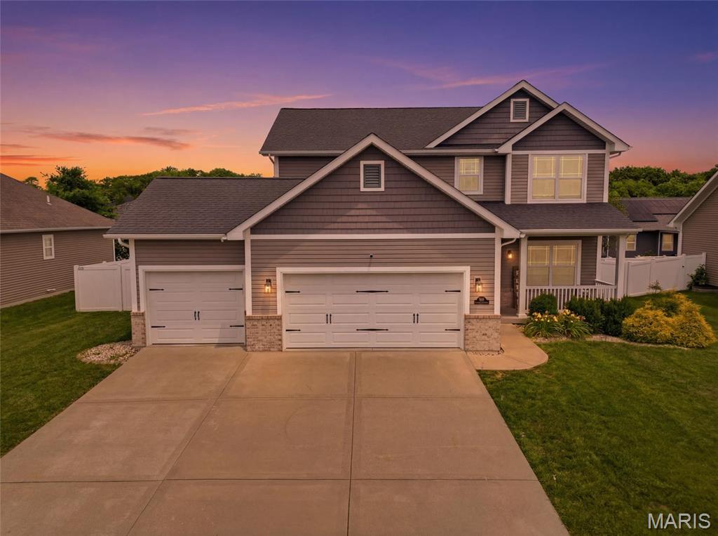 Beautifully designed with an open floor plan and warm hardwood flooring throughout the main level, this home offers the perfect combination of style, comfort, and functionality. The spacious kitchen features stainless steel appliances, abundant prep space, and opens seamlessly to the dining area and living room, where a gas fireplace creates a warm and inviting gathering space. A versatile main-floor flex room offers endless possibilities, perfect as a home office, formal dining room, playroom, or quiet sitting area to fit your lifestyle.

Upstairs, the expansive primary suite offers a private retreat with a walk-in closet and en-suite bath, while two additional bedrooms provide generous space and ample storage. The finished lower level adds incredible versatility with a wet bar, fourth bedroom, and full bathroom, ideal for entertaining, guests, or multi-generational living.

The backyard is truly a standout feature. The large, level yard offers plenty of room to play, entertain, or simply relax, complete with a covered patio, built-in fire pit, and a private basketball sport court. Whether you're hosting friends, watching the kids play, or enjoying a quiet evening outdoors, this space is designed to be enjoyed year-round.

Thoughtfully maintained and move-in ready, this home combines everyday comfort with exceptional indoor and outdoor living. Don't miss the opportunity to make it yours!