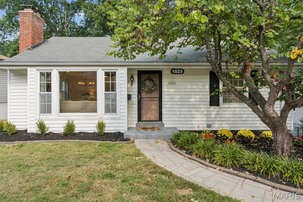 This adorable 2-bedroom, 2-bath Crestwood home is freshly painted throughout—even the ceilings—and filled with natural light from a charming front bay window. Beautiful hardwood floors were refinished in a natural oak finish in 2025, when new recessed lighting was also added. The fireplace creates a Pinterest-worthy focal point, while the open flow between the living and dining rooms makes entertaining feel effortless. Two comfortable bedrooms share a cute vintage-tiled bathroom full of character. The efficiently designed kitchen opens to a spacious sunroom overlooking a peaceful backyard retreat with a patio and hot tub, which stays with the home and is sold as-is. There’s plenty of room to garden, plus a storage shed and additional driveway parking beyond the tuck-under garage. Back inside, new ceiling fans (2026) add a fresh finishing touch, while the lower level offers a flexible bonus room for an office, hobbies or game nights, along with a laundry room and second full bath. New landscaping enhances the inviting curb appeal, complete with a beautiful spring-blooming tree. Just steps from Grant’s Trail and Ferndale Park—and minutes from the new shopping and dining at Crestwood Crossing—this peaceful retreat combines warmth, character and everyday convenience in one of St. Louis County’s most sought-after communities.