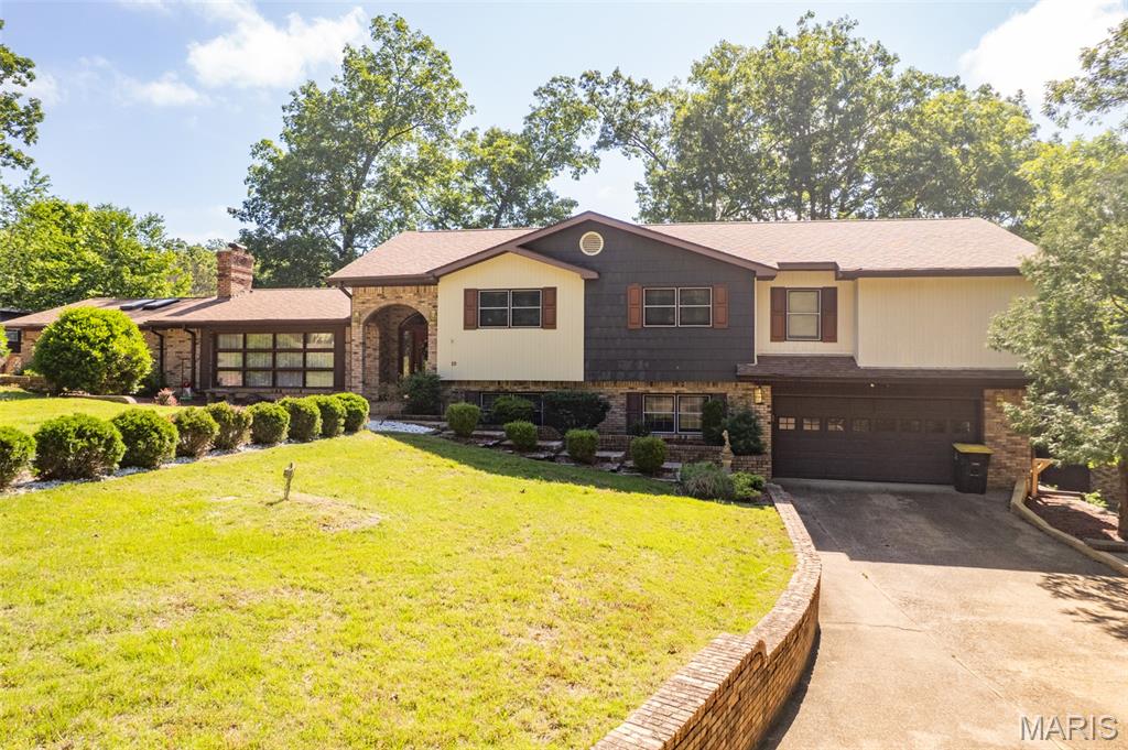 Check out this remarkable home on the edge of city limits in Doniphan on the desirable Fox Drive sitting on 5 acres +/- with attached and detached garage, a beautiful pond with water fountain (on its own private well!!) overlooked by the massive back deck, and so much more! This home has it all including a large master bedroom with large closet, bathroom and even a sauna! Downstairs could be separate living quarters and the home includes many recent updates from kitchen, to flooring and more!! This is perfect for the growing family wanting something for many years to call home!! The home has way to many special features to list, so look at all the pictures and call today for your showing before this once in a lifetime home is gone!