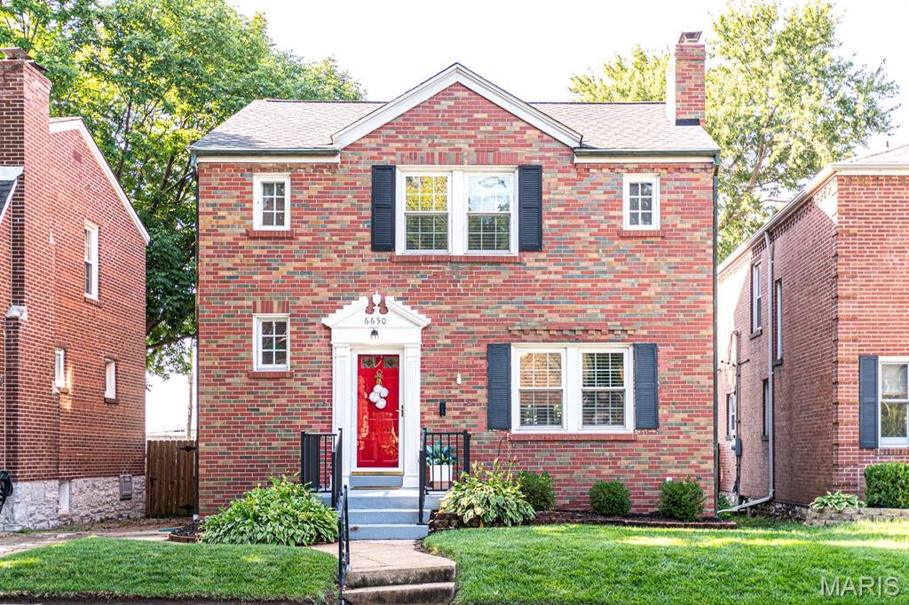 Brick, South City, Beautifully Landscaped, 2-story in Lindenwood Park Neighborhood offers 2 bedrooms, 1.5 baths and all the historical charm and characteristics in the details: arched doorways, cove ceilings, scroll bannister, and original beveled wood doors. Hardwood floors in LR, DR, stairwell, and both bedrooms. Main floor consists of spacious living room with great natural light and fireplace wall as the focal point, separate dining room that opens to the sunroom through french doors, which could be great for entertaining. Light and bright, Eat-in kitchen has some S/S appliances, oak cabinets and pantry. Convenient sunroom and main floor bathroom too! The beautiful metal staircase leads to the 2nd floor with two large bedrooms and classic tile full bathroom. There is attic access through a doorway with staircase in bedroom 2. Partially finished, lower level recreation room offers a bit more space to spread out.  Walk out basement also provides Laundry area and extra storage space. Lovely Fenced, level backyard with patio has 1 car detached garage.  6650 Sutherland is close to many popular restaurants, shops, and services. Updates include: Roof +/- 8 years, Windows +/- 6 years, sewer lateral line, HVAC +/-5 years, electric panel.