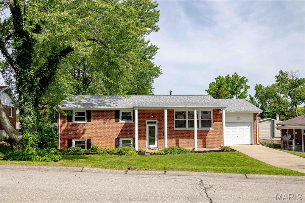 Welcome to this beautifully updated split-level home nestled in one of St. Charles’ most sought-after, well-established neighborhoods. Set on quiet, tree-lined streets, this charming brick residence offers timeless appeal paired with thoughtful modern updates throughout.
Step inside to find original hardwood floors on the main level, beautifully refinished to highlight their natural character and warmth. Abundant natural light fills the home, creating an inviting and comfortable atmosphere in every room.
The heart of the home is the stunning, fully updated kitchen—featuring crisp white shaker cabinetry, stainless steel appliances, butcher block countertops, and stylish new fixtures. Designed with both function and entertaining in mind, it’s a space you’ll truly enjoy spending time in.
The main level includes three well-appointed bedrooms, all enhanced with new ceiling fans for added comfort, along with a refreshed full bathroom and fresh interior paint throughout. An attic fan adds extra efficiency and year-round comfort.
The spacious lower level offers exceptional versatility, complete with luxury vinyl plank flooring, a full bathroom, a large private room ideal for a home office, guest space, or additional sleeping area, plus generous storage options. The lower level also features a walk-out through French doors, providing easy access to the backyard and enhancing indoor-outdoor living.
Outside, the fenced backyard is a private retreat featuring a well-established, seasonally blooming garden and a welcoming patio—perfect for relaxing evenings or weekend cookouts with family and friends.
Additional highlights include an oversized attached one-car garage with ample street parking available, a newer roof, and a convenient location close to shopping, schools, and beautiful local parks.
This home blends classic charm with modern updates in an ideal location—ready for its new owners.