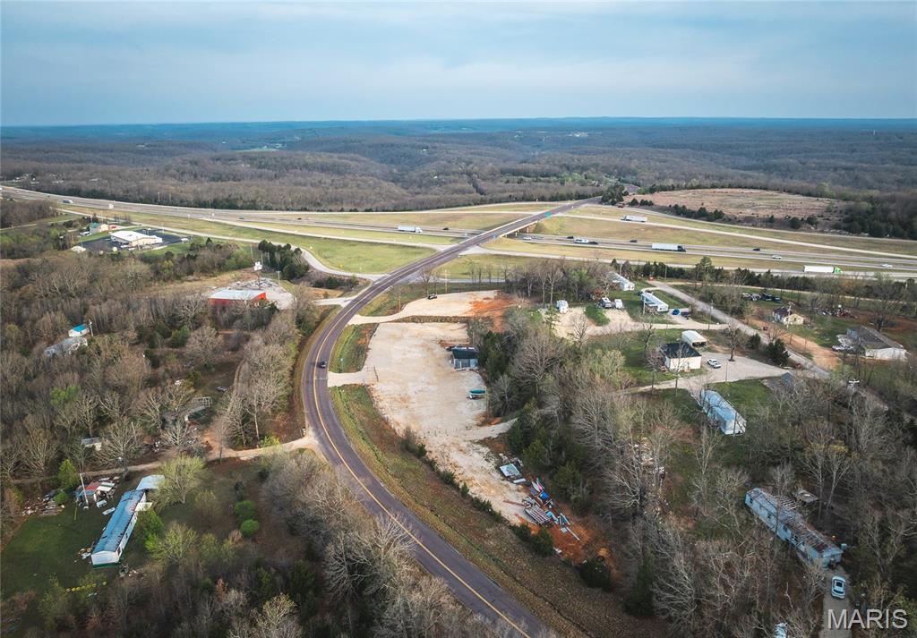 Prime commercial opportunity in a high-visibility corridor!

Positioned at the Highway 7 exit off I-44 between Saint Robert and Lebanon, this versatile 3 m/l acre property offers outstanding access and exposure in one of central Missouri’s most traveled routes. Located just minutes from Richlandand within a short drive to Lake of the Ozarks, this site is ideally situated for a wide range of commercial or investment uses.

The property is partially fenced and gated, providing added security and flexibility for development. With water and electric already available on-site, much of the groundwork is in place to bring your vision to life. The seller is willing to subdivide, making this an excellent option for buyers seeking a smaller parcel or multiple development opportunities.

I-44 is a major east-west corridor with strong daily traffic flow—typically seeing tens of thousands of vehicles per day in this stretch—offering exceptional visibility and consistent exposure for any business venture.

Whether you're considering retail, service-based business, storage, or other commercial development, this location combines accessibility, infrastructure, and growth potential in a thriving area of the Ozarks.