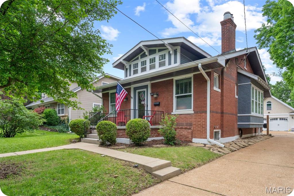 Charming brick bungalow in highly sought-after Webster Groves offering nearly 1,800 sq ft of finished living space filled with timeless character and modern updates including a new roof in 2025. This 2 bed, 2 full bath home features beautiful hardwood floors throughout the main level, a formal living room with decorative fireplace and stained glass windows, and a gracious dining room highlighted by a wall of windows that fills the home with natural light. The updated kitchen offers white cabinetry, granite countertops, and stainless steel appliances. An expansive family room at the back of the home with a second fireplace provides the perfect space for entertaining or relaxing. The partially finished lower level functions as a private suite-style retreat, featuring a large sleeping or recreation space, full bath, and adjoining bonus room currently used as a movie room and walk-in closet. With separate exterior stair access to the driveway and backyard, the space offers exceptional flexibility for guests, a home office, workout area, or additional living space. Enjoy the spacious backyard and fantastic patio area perfect for entertaining, play, or outdoor dining. Incredible oversized 2-car garage with loft space above offers exciting expansion potential. Already accessible by a full staircase with electricity and partial insulation in place, the loft could easily become a home office, studio, or additional living space with the addition of a mini split system. Located in the highly regarded Webster Groves School District close to parks, shopping, restaurants, and all that Webster Groves has to offer.