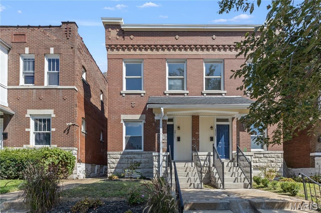 A brick townhome in Tower Grove East with over 1,800 square feet, 3 bedrooms, 2.5 baths, a beautifully updated kitchen and bathrooms, a newer roof, off-street parking, and a low-maintenance backyard.

Walk up and the brick does the talking — corbelled cornice, dentil detail, limestone sills, stone foundation, and a covered front porch made for a morning cup of coffee.

Step inside and it's instantly cozy. The living room is just right, full of natural light, and flows into a dining room that's its own space. Then the kitchen — light, airy, and bigger than you'd guess. Brand new white shaker cabinets, black hardware, fresh quartz counters, pearl subway backsplash, and room for an island with space left to move.

First-floor laundry for convenience. The half bath off the kitchen is a little jewel box: deep green vanity, brass pulls, arched mirror, hex tile.

Upstairs, three nicely sized bedrooms and two full baths, both beautifully updated. The primary bath has a fluted green double vanity, marble-look top, arched mirrors, and a stacked green tile tub surround. The primary bedroom even opens to its own deck.

Out back, a low-maintenance fenced yard and off-street parking off the alley.

Tower Grove East, right at the edge of Fox Park — less than a mile from Tower Grove Park, two blocks from Little Fox, a third of a mile from Lona's Lil Eats, with Cherokee Street a short walk south. I-44 and I-55 are minutes away.

Cozy, move-in ready, and more than the photos can hold. Come see it!