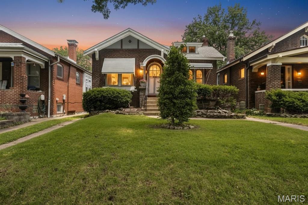 A tremendous investment opportunity awaits!  Nestled in the heart of the highly sought-after Holly Hills neighborhood, this charming all-brick 2bd/1ba bungalow offers the perfect blend of timeless character and classic South City appeal. Creating an unforgettable first impression is the rustic & custom arched solid core wood front door, along with the inviting front porch accessed through elegant French doors.  Rich, well-kept wood floors grace much of the main level, which is filled with architectural details that tell a story including historic millwork, stained glass windows, archways, and a decorative non-functioning wood-burning fireplace--all of which showcase the craftsmanship of a bygone era. A bright sunroom provides additional living space and a cozy retreat for morning coffee or evening relaxation. The clean, dry basement offers exceptional storage and future possibilities. Outside, enjoy a fenced backyard with a patio, along with a rare all-brick detached one-car garage (accessed by shared driveway). Located just moments from the tree-lined streets, parks, restaurants, and neighborhood charm that make Holly Hills one of St. Louis' most beloved communities, this home is a true opportunity to own a piece of South City's rich history.