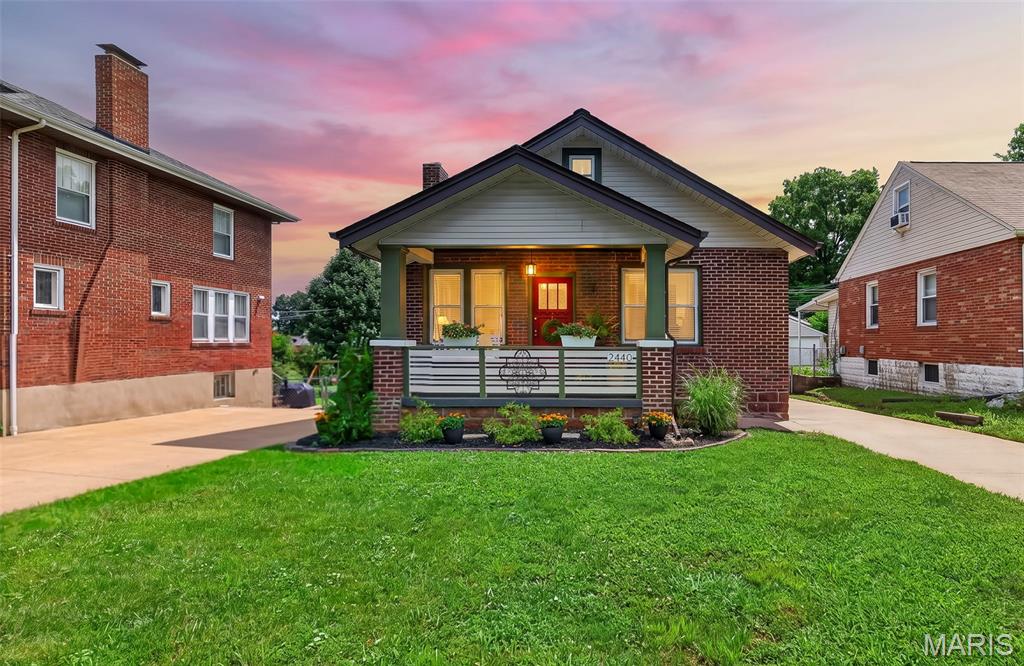 Fabulous Craftsman style home - renovated to intentionally protect original features of this 100 year old home.  2440 Northland is located on a beautiful, quiet, tree lined street in Sycamore Hills where neighbors are friendly and care for their homes.  Location makes it easy to get anywhere in St. Louis.   The front porch welcomes you and even includes a porch swing to enjoy your morning coffee.   As you enter the home the original wood floors are warm and gleaming and the built in bookshelves are original - even the hardware!  Updated Kitchen include new appliances, counters, with new upper cabinets.  The  Bath is updated with new vanity, flooring, shower door, & faucets.  Large rooms offer plenty of space for family gatherings - two bedrooms (one would make a delightful home office).   New sump pump, AND new concrete pour in tuck under garage.   2 CAR DETACHED GARAGE PLUS A SINGLE BAY TUCK UNDER GARAGE - AND LOTS OF PARKING SPACES!!  This home is special and ready for the next home owner to make it their own.