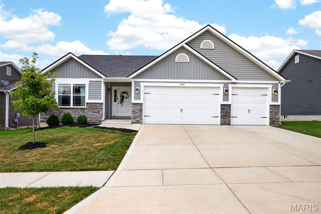 Welcome to Timber Trace! A coveted Wentzville neighborhood with elegant craftsmanship and pride of ownership. This 4 bed / 3 bath has been extremely well maintained and well kept and is full of tasteful designs and a bright and neutral color scheme throughout. You're welcomed into a spacious entry foyer that draws you in to an open floor plan design with 11 ' ceilings throughout, stone surround gas fireplace, recessed lighting  and full of natural light from the upgraded transom windows! Kitchen features 42" wood cabinets, crown molding, granite counter tops, stainless steel appliances, center island and breakfast bar and plenty of room for a full sized kitchen table. Through the french doors you'll find the sprawling primary suite features dual vanity with granite top, huge soaking tup, walk-in shower, and spacious walk-in closet. This split bedroom floor plan has 2 additional spacious bedrooms and updated hall bathroom. Lower level has been recently finished with a 4 bedroom and full bathroom. Enjoy a back yard you have always DREAMED of! Fully fenced, with a HUGE stamped patio, and pergola ! This is everything you have been searching for and a total MUST SEE. Schedule your private showing today!