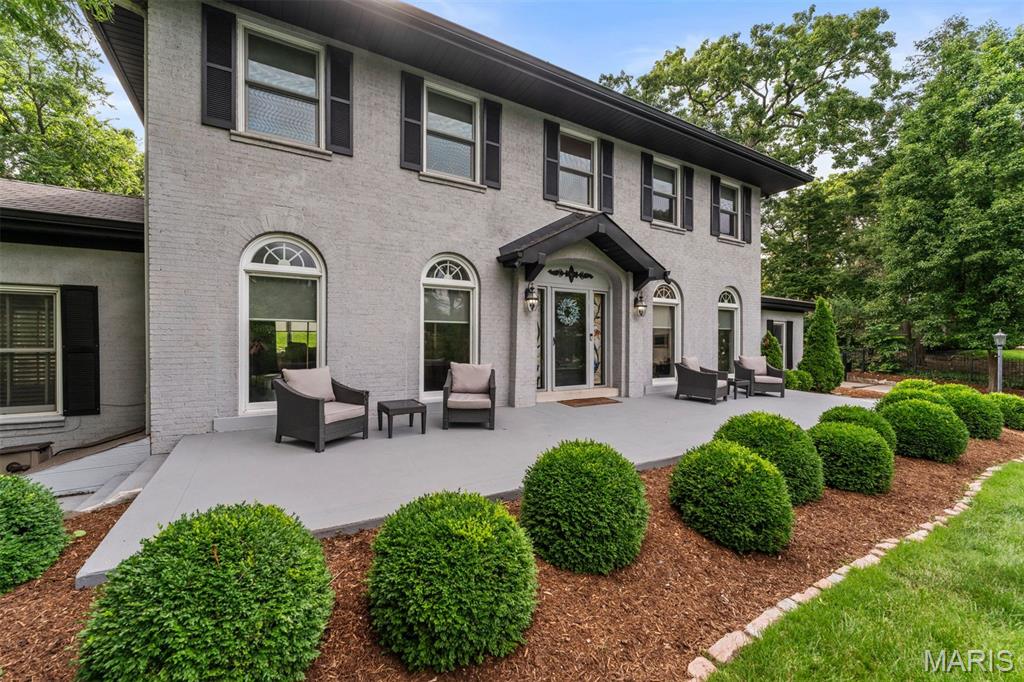 This 1920 gem sits on 1.11 acres of lush, professionally landscaped grounds filled with blooming annuals and perennials. The backyard is a summer sanctuary—anchored by a heated pool and a decorator’s dream cabana with a loaded kitchen, enormous fan, and TV. It’s the perfect spot to gather with friends, sip cocktails, and soak in golden-hour evenings in the heated pool surrounded by hidden speakers serenading you with your favorite tunes. Inside, 4,392 sqft showcase arched doorways, Palladian and stained glass windows, and beautifully restored original wood floors. The open kitchen flows seamlessly into elegant living spaces with soaring fireplaces and preserved millwork. The dreamy primary suite includes a showstopping closet with island and laundry (that sellers are willing to convert back to the 4th bedroom; with the closet there are 3 bedrooms), plus a spa bath with sauna, steam shower, and round soaking tub. Two addl bedrooms upstairs share a private, connected bathroom. The walk-out lower level features a full bar, movie theater with terraced seating, gym/sleeping area with attached full bath, and second laundry - plus loads of storage space. If the outdoor features aren't enough to monopolize your attention, the interior will captivate you with its rare blend of history, beauty, and effortless luxury.  Maplewood/Richmond Heights award winning schools ranking #9 in the state of Missouri by Niche.com.