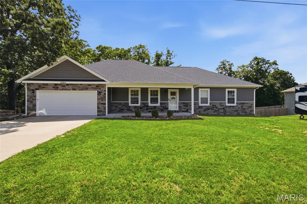 MOVE IN READY !!! ---AND now available for RENT or SALE--- This beautiful 4-bedroom, 3-full-bath home offers the rare opportunity to own a 3 year old home on 7.83 acres of unrestricted land- AND STILL be close to town and Fort Leonard. Since it is such a newer home buyers can spend less time worrying about the high ticket items such as the roof, HVAC system, appliances, and other major features, and more time to enjoy the home and property and less reason to expect costly replacements right away.

The thoughtfully designed main level features an open kitchen, dining and living area filled with natural light. From the dining area, step directly onto the covered back deck overlooking your own wooded acreage—with no neighbors directly behind you, just land, trees, and plenty of deer wandering throughout.

The large primary bedroom offers plenty of space and includes a private bathroom with a double vanity, and a large walk-in closet. Two additional bedrooms and another full bathroom complete the main level.

The walk-out basement adds a large recreation area, fourth bedroom, full bathroom, laundry area and bonus room. It also includes a separate John Deere garage, perfect for the mower, ATV, tools, or use as extra storage!

The sellers have created their own little camping spots throughout the property and enjoy exploring the woods. 

 Enjoy the convenience of  living  close to town, while still having nearly 8 unrestricted acres, no neighbors directly behind you and a beautiful newer home—all at a reasonable price. Buyers searching in the St. Robert–Waynesville area know this combination does not come along often. Come take a look and share your thoughts!
