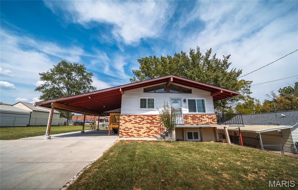 Welcome to this super charming 4-bedroom bungalow, where classic character meets thoughtful updates and comfortable everyday living. From the moment you step inside, you’ll appreciate the bright, airy atmosphere and inviting spaces that make this home feel warm and welcoming. The main level features beautiful hardwood flooring and an open-concept living area that creates an easy flow for relaxing, entertaining, and spending time together. The updated kitchen is full of personality, complete with a built-in breakfast nook that’s perfect for morning coffee, casual meals, or catching up at the end of the day. Need a little extra room to spread out? The finished basement adds valuable living space with durable laminate flooring, offering plenty of flexibility for a family room, game room, home office, workout area, or guest space. A second bathroom is located in the basement; however, the tub is currently non-functioning, providing an opportunity for the next owner to complete the space to suit their needs. Outside, the fenced backyard is ready for pets, play, gardening, or weekend gatherings. A backyard patio provides a great spot for grilling and outdoor dining, while mature trees offer welcome shade on sunny afternoons. An attached carport adds convenient covered parking and easy access to the home. With its charming bungalow style, updated interior, flexible finished basement, and inviting outdoor spaces, this home has so much to offer. Schedule your private showing today and come see why this charming property could be the perfect place to call home!