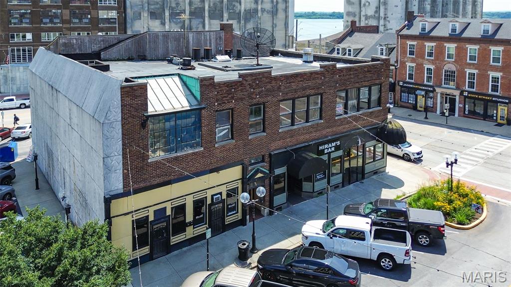 Mixed-use commercial building located in the heart of downtown Alton. Comprised of  three storefront spaces, including a former bar/restaurant and two additional retail storefronts. The second floor features three apartment units—one recently occupied and now vacant, plus two units ready to be completed. The City of Alton offers TIF incentives for qualifying residential improvements, creating additional redevelopment potential. Conveniently located near downtown shops, restaurants, entertainment, and the Mississippi River. Property is being sold as-is and offers a great opportunity for investors, business owners, or developers looking to add value.