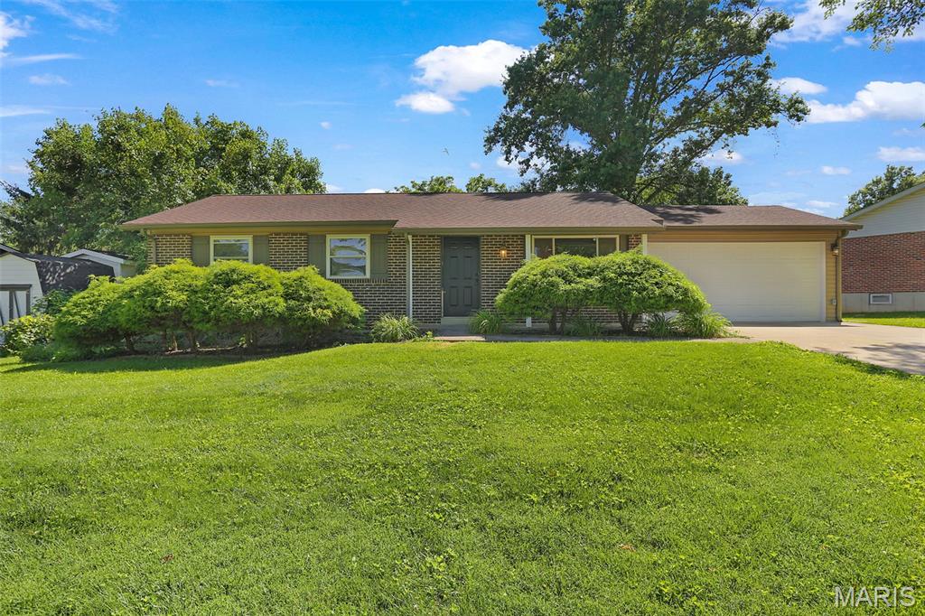 Welcome home to 419 Woodbridge Drive in the desirable Woodcliff Manor neighborhood of St. Charles! This well-maintained 3-bedroom ranch offers comfortable living space, a functional floor plan, and a fantastic location within the sought-after Francis Howell School District.  Step inside to a bright and inviting living room that flows seamlessly into the spacious eat-in kitchen, featuring ample cabinet space, a pantry, and plenty of room for family gatherings. Three generously sized bedrooms and a full bath complete the main level.  The finished lower level provides additional living space with a large family room, recreation area, bonus room perfect for a home office, workout room, or playroom, an additional full bath, and abundant storage space.  Outside, you'll love the level privacy-fenced backyard, offering the perfect setting for entertaining, children at play, pets, gardening, or simply relaxing outdoors. The oversized patio provides plenty of space for summer barbecues and gatherings with family and friends. An attached 2-car garage and extended driveway offer ample parking and storage. Conveniently located near Highway 364, shopping, dining, parks, and schools, this move-in-ready home offers the perfect combination of comfort, convenience, and value. Don't miss your opportunity to make this wonderful St. Charles home your own!