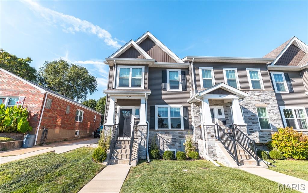 Refined Elegance Meets Effortless Living in the Heart of Richmond Heights. Welcome home to 7729 Dale Avenue, a meticulously appointed end-unit townhome offering over 2,300 square feet of sophisticated living across three beautifully finished levels. Rich luxury vinyl plank and designer tile flooring flow throughout, setting the tone for a home where style and substance meet in perfect balance. The main level unfolds in an open-concept design tailored for effortless entertaining, while the tuck-under two-car garage offers both convenience and abundant storage. Ascend to the upper level, where a thoughtfully placed second-floor laundry room simplifies everyday living, and the primary suite awaits as a true private sanctuary—complete with an expansive walk-in closet and a spa-inspired walk-in shower. The finished lower level extends the home's versatility with a full bath and a flexible bonus space, perfectly suited for a guest suite, private office, or refined recreation room. Beyond the front door, an unbeatable address delivers unmatched lifestyle appeal: just 0.3 miles to The Heights Community Center, under 2 miles to the scenic beauty of Forest Park, and mere moments from the boutique shops and celebrated dining of Brentwood Promenade. This is more than a home—it's a rare opportunity to embrace low-maintenance luxury in one of Richmond Heights' most coveted locations