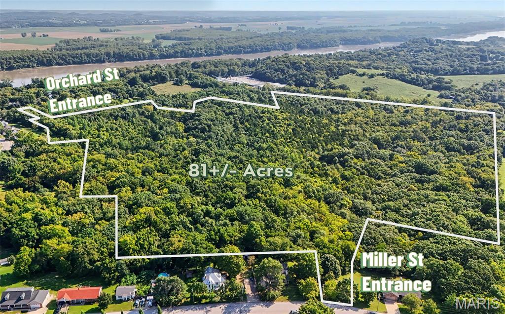 Rarely does an opportunity of this scale become available inside the city limits of a community the size of New Haven.  Located just 9 miles from the Washington City Limits, this exceptional 81± acre tract offers a unique combination of size, location, zoning, access and future residential potential that is increasingly difficult to find.

Located just off Miller Street, one of New Haven's important residential corridors, the property has surveyed access connecting directly to Miller Street and is situated in close proximity to New Haven Elementary School. A secondary access point is also available from Orchard Street, providing additional connectivity and flexibility for future planning.

The property is currently zoned R-1A for single-family residential use, creating an exceptional opportunity for a residential developer, builder, investor or individual seeking a large tract with significant potential for future residential development. The acreage could lend itself to a thoughtfully planned subdivision, potentially developed in phases, or could be preserved as a larger private residential tract with the opportunity to create an extraordinary estate setting within the city limits.

Historically, portions of the property were open pasture, while much of the acreage has naturally transitioned to a wooded setting over recent years. The combination of open areas, mature growth and natural terrain creates opportunities for a development that incorporates privacy, wooded views and natural features into its overall design.

Potential concepts may include a traditional single-family subdivision, larger estate-style residential lots, a custom-home community, phased residential development, or a private family estate. The property's size also provides an opportunity for a developer to thoughtfully design streets, lots, green space and natural amenities rather than being constrained by a small infill site.

Perhaps most importantly, this property offers something becoming increasingly scarce in the area: a substantial tract of undeveloped land located within city limits with access to the community's existing infrastructure and services. Buyers should conduct their own due diligence with the City of New Haven and applicable utility providers regarding utility availability, capacity, development requirements, subdivision regulations, allowable density, access, drainage and all other development considerations.

For a developer, this is an opportunity to acquire a truly significant piece of New Haven with the potential to shape an entire residential community. For an individual buyer, it represents the rare opportunity to own an exceptionally large and private tract while remaining within the city limits and close to schools, downtown and everyday conveniences.