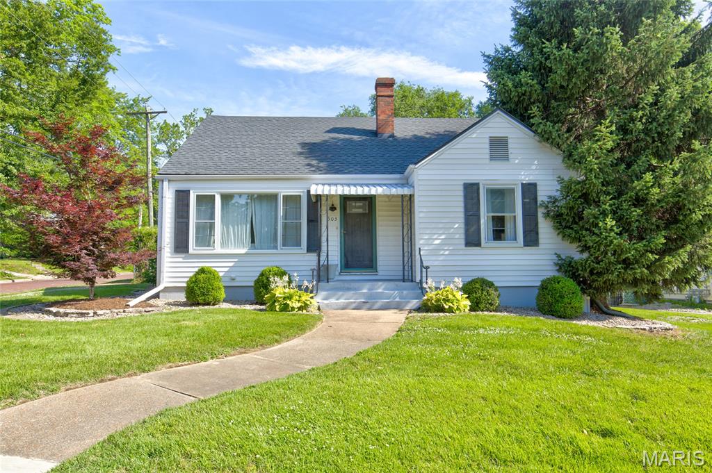 Charming home conveniently located in the heart of Edwardsville!  At a little over 2000 square feet this move-in ready 1.5 story is tastefully decorated and offers 4 bedrooms, 3 baths, a full finished basement, and a detached 2 car garage.   The main level offers an updated kitchen, dining room, living room, 2 bedrooms and a full bath.   The primary bedroom suite including primary bathroom are located on the upper level.   The lower level offers a family/media room, office, 4th bedroom, a bathroom, and utility/laundry room.    This home is situated on a corner lot, and exterior features include a fenced backyard with patio, a firepit area, and 2 covered porches.   Don't miss this opportunity to make this home yours!!