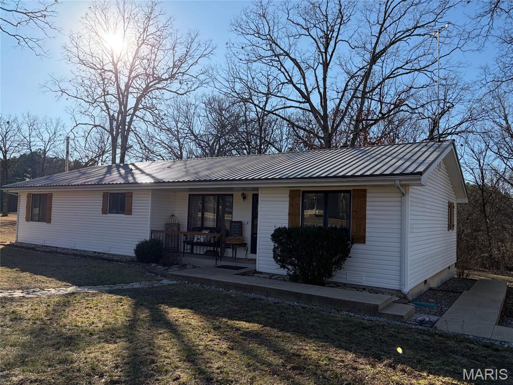 Spacious, very nice well-maintained Ranch style home with detached garage situated on 2.00 acres m/l in a quiet neighborhood located just minutes out the Southgate of Fort Leonard Wood. The home has an awesome living room space featuring vaulted ceilings with beautiful beams, a cozy fireplace and plenty of room for relaxing. The wonderful kitchen features tons of cabinets, beautiful backsplash, center island, and bar making a great space for cooking and gathering together with family and friends. The master bedroom features a large walk-in closet and a great master bath complete with jetted tub and separate shower.  This area is a great location for the avid outdoorsman; there's an abundance of hunting opportunities in the nearby Mark Twain National forest located just minutes from home. This home has a lot to offer!!!