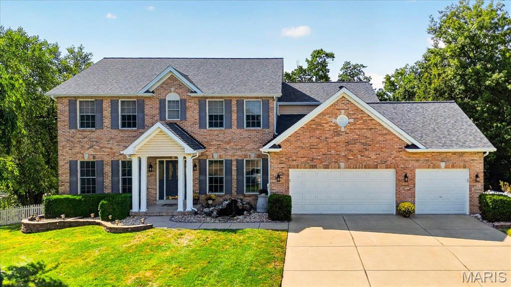 OPEN THURSDAY Sept 17th 4-6 PM. Rare multi-generational luxury meets an outdoor paradise in sought-after Stonecroft! Tucked away on a beautifully landscaped 0.32-acre cul-de-sac lot, this magnificent 5-bedroom, 5-bathroom home boasts an expansive architectural layout enhanced by a dramatic double bump-out design. You are greeted at the entrance by the tranquil sounds of a custom front-yard koi pond near the front door, creating unforgettable curb appeal. Step inside to find brand-new luxury vinyl plank flooring stretching across the entire main level, perfectly accentuating the grand great room with its cozy fireplace, surround sound, and soaring wall of windows. The heart of the home features a freshly modernized kitchen with cabinets painted in a timeless Alabaster White, a granite center island, upgraded appliances, and a separate hearth room with bay windows. The highly functional floor plan perfectly accommodates family and guests with a dual primary suite configuration—featuring a full master retreat on the main level and a second private master suite on the upper floor. The second level also showcases brand-new plush carpeting and an intelligent layout where every single bedroom has dedicated bathroom access, including two bedrooms sharing a Jack & Jill bath and another enjoying its own private en-suite. The massive walk-out lower level offers incredible equity potential for your future custom finishes, but already features a unique custom accent wall and a built-in relaxing sauna. The resort-style living continues in the private backyard, featuring an expansive deck and patio where you can unwind in the secluded hot tub. Complete with a 3-car garage and award-winning Francis Howell schools!