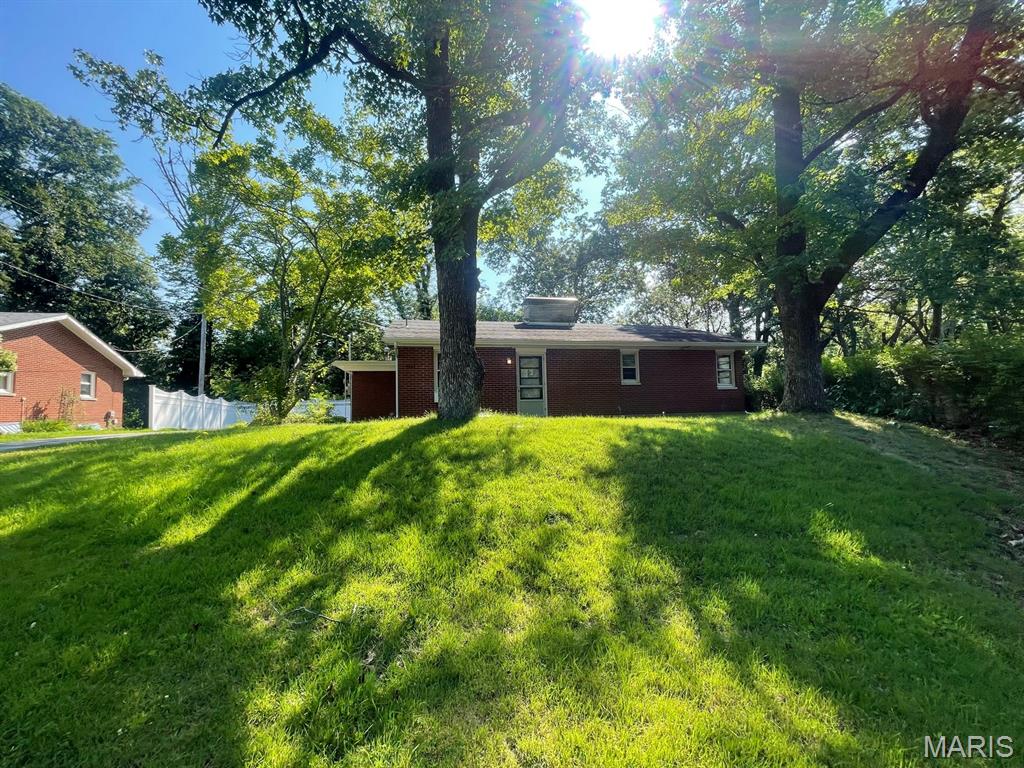 Welcome home to 2131 Hill Crest Drive in Highland! Tucked away on a quiet, circular street, this charming full-brick ranch offers comfortable one-level living with a peaceful setting that backs to mature trees. The inviting living room is highlighted by a beautiful masonry wood-burning fireplace and large windows that showcase the scenic wooded backdrop. The home offers two spacious bedrooms and two full bathrooms, including convenient main-floor laundry. An attached one-car garage provides additional storage and everyday convenience. Ideally located within walking distance to the elementary school, neighborhood park, city pool, and the nearby Lindendale Park Ballroom and park grounds, this home combines a quiet neighborhood setting with easy access to Highland's local amenities. This property is one you won't want to miss. Schedule your private showing today! ALL information is deemed reliable but is not guaranteed and should be verified by the buyer and/or buyers agent before making an offer.