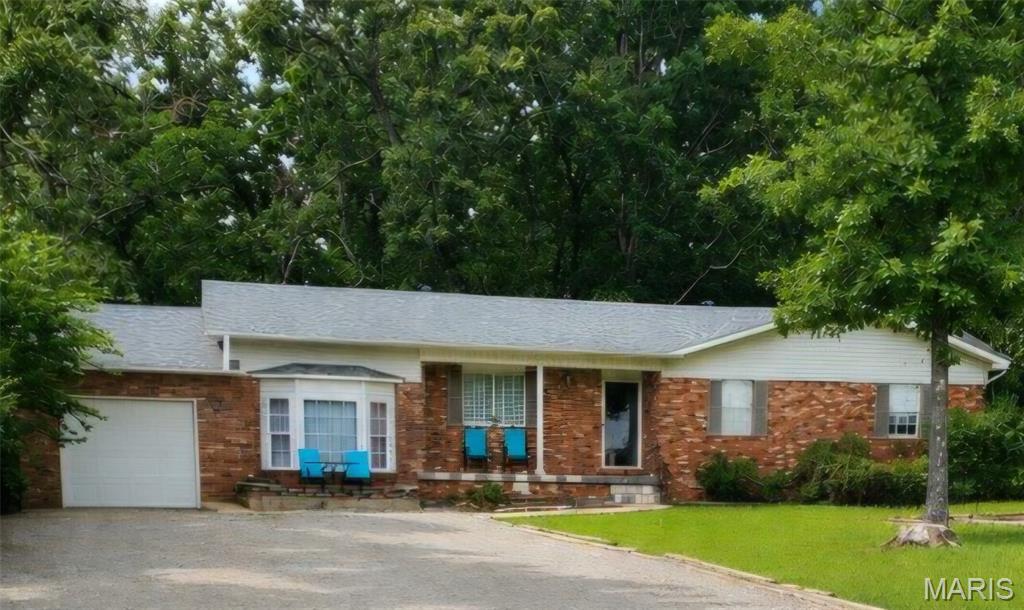 **Peaceful Country Living on a Beautiful 1-Acre Lot in Doniphan**

Discover the perfect blend of comfort, space, and small-town charm in this impeccably maintained 3-bedroom, 2-bath home situated on a picturesque 1-acre lot in Doniphan. Thoughtfully updated and truly move-in ready, this property offers modern conveniences while maintaining its warm, welcoming atmosphere.

Step inside to find a functional floor plan designed for everyday living and entertaining. The spacious primary suite features a private full bath, while the additional bedrooms are conveniently located near the main bathroom with an oversized vanity area. Natural light pours into the sunken family room, creating a cozy and inviting space for relaxing or gathering with family and friends.

Recent improvements provide peace of mind and exceptional value. A new roof was installed in 2023, and in 2024 the home received an impressive list of updates, including a new heat pump, water heater, appliances, toilets, ceiling fans, and interior light fixtures. Additional enhancements include new flooring, baseboards, interior doors, fresh paint throughout, a new primary bathroom vanity, a custom primary closet organizer, and updated hinges and hardware on the kitchen cabinets and main bathroom vanity. Every detail reflects pride of ownership and thoughtful maintenance.

Outside, the expansive 1-acre lot provides endless possibilities. Whether you envision a garden, outdoor entertaining space, play area, or simply a peaceful place to enjoy the fresh Ozark air, you'll appreciate the privacy and room to spread out while still being conveniently located near town.

Nature enthusiasts will love the location. Just minutes from the beautiful Current River, you'll enjoy easy access to floating, fishing, kayaking, and swimming. Nearby Mark Twain National Forest offers hiking, hunting, wildlife viewing, and endless outdoor recreation opportunities. Combined with the area's friendly community and relaxed pace of life, this property is the perfect escape from the hustle and bustle.

Whether you're searching for a full-time residence, a weekend retreat, or a place to enjoy the beauty of rural Missouri, this home offers comfort, quality updates, and access to some of the region's most treasured natural attractions.

**Don't miss your opportunity to own this beautifully updated home—schedule your private showing today!**

UPDATE!!! Fresh gravel in the driveway and brand new 1000 gallon septic tank.