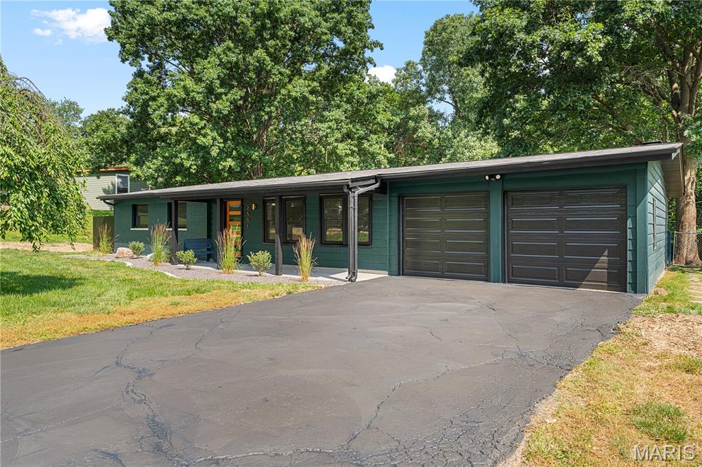 Located in the historically designated Barrette Brae neighborhood, this Fischer & Frichtel mid-century modern home is anything but ordinary. Updated inside and out, this one-of-a-kind residence blends original architectural character with fresh design and modern functionality.

The home was professionally designed to honor its mid-century roots while adding thoughtful updates, unique finishes, and personality throughout. The result is a home that feels stylish, comfortable, and completely livable.

Featuring three bedrooms, a spacious living room, updated kitchen, cozy den, and true one-level living, this home is perfect for the everyday but spacious enough for entertaining.

The major spaces of the home have been redesigned and expanded, including the kitchen, laundry room, and primary bathroom. Ceilings were raised to the roof pitch in both the hall bathroom and primary suite, creating a greater sense of space and architectural detail.

The updated kitchen features all new appliances, quartz counters, under cabinet lighting, vaulted ceilings with accent lighting, and a large peninsula so you have the space to prep, cook, and serve. 

The outdoor spaces are a blank canvas for you to make all your own. With a huge screened-in porch, you almost double your living space with a bug free indoor/outdoor experience. The expansive, flat backyard has started professional lawn treatment for weed management. With a patio, new fencing this backyard is a perfect template for endless possibilities. 

A rare feature in Barrette Brae, the enclosed two-car garage adds convenience and value in a neighborhood where carports are more common.

This is a unique mid-century modern home that has been updated for today’s lifestyle while preserving the architectural details that make it special. Located in one of the area’s most recognizable MCM neighborhoods, this home offers design, function, and opportunity all in one.