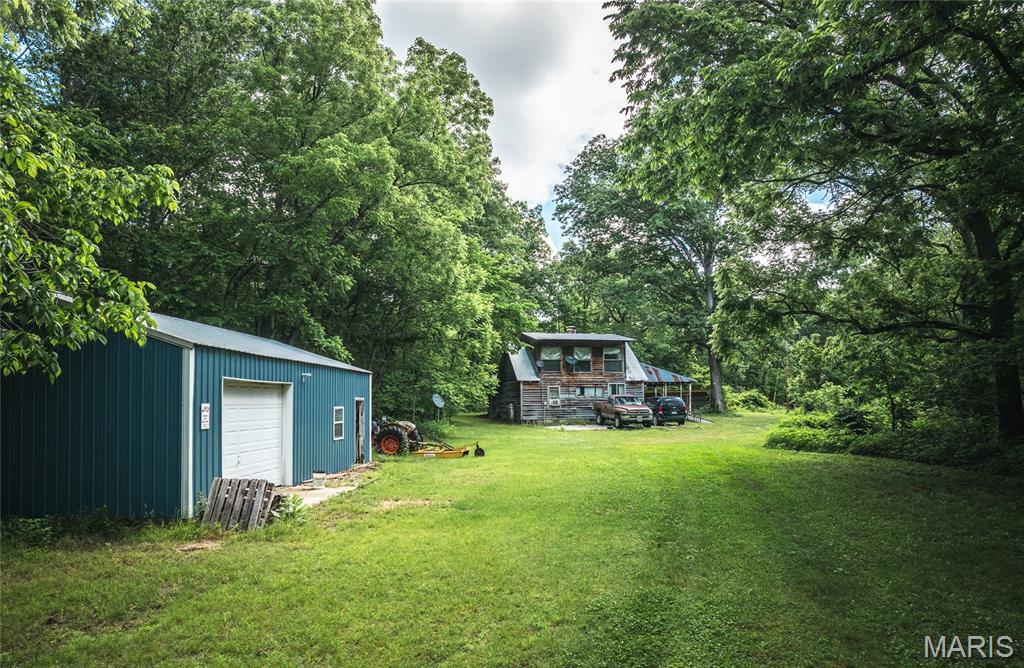 Escape to the heart of the Ozarks with this one-of-a-kind secluded retreat, perfectly suited for hunters, fishermen, outdoor enthusiasts, or anyone searching for peace, privacy, and endless possibilities. Surrounded by acres of forest, including, close by, approximately 1,500 acres of conservation and state park land, this remarkable property offers the rare opportunity to truly disconnect and enjoy nature at its finest.
The land features rolling hills, scenic valleys, multiple high vantage points, a large dry creek bed fed by spring runoff, and a network of accessible trails that could keep you exploring for hours on this 50+/- acres. Wildlife is abundant, with frequent sightings of deer, turkey, fox, coyotes, ducks, hawks, owls, herons, raccoons, and more. Fossils, arrowheads, and natural beauty can be discovered throughout the property, making every walk an adventure.
Included is a charming 1-bedroom, 1-bath rustic cabin built from timber harvested directly from the property and charming findings from the town of the time, offering an authentic Ozarks feel and the perfect hunting cabin, weekend getaway, or basecamp for outdoor recreation.
Located approximately 4 miles from Montauk State Park and the Current River, this property provides quick access to some of Missouri’s best trout fishing, floating, canoeing, and hiking opportunities. The surrounding state land offers miles of exploration where solitude and nature take center stage.
Whether you envision building your dream home, creating a private recreational retreat, developing a hunting property, or simply owning a quiet escape from city life, this property offers unmatched privacy, beauty, and potential. If you’re looking for crowds and noise, you won’t find them here, but if you’re searching for serenity, adventure, and a place to call your own, this Ozarks retreat is truly something special.